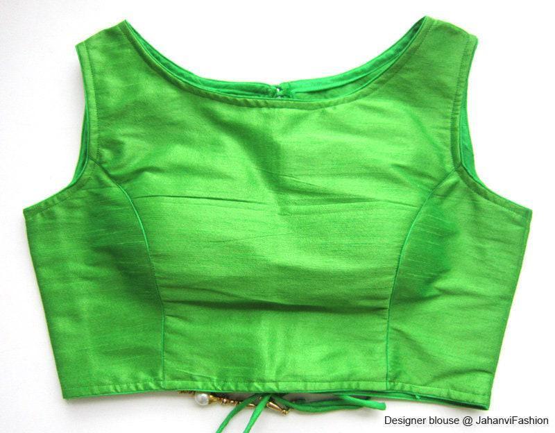 Green boat-neck sleeveless saree blouse with smooth front panel and stitched side seams
