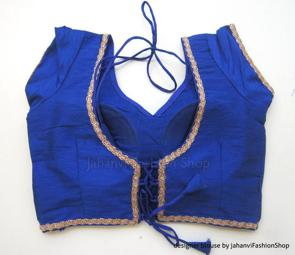 Royal blue bridal blouse with gold trim, deep V neckline and blue tie cords