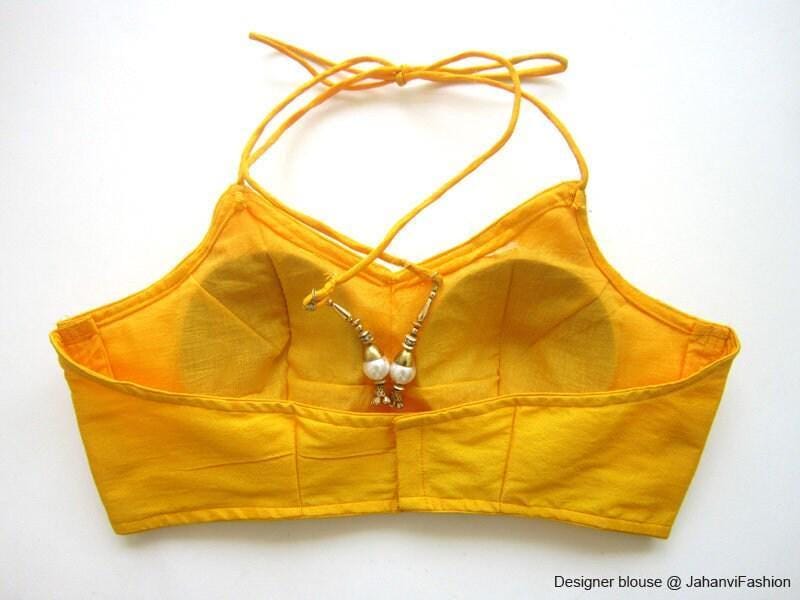 Mustard halter bikini-style saree blouse with backless ties and pearl clasp