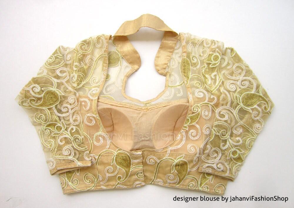 Golden embroidered saree blouse with long sleeves and U-shaped neckline with lining