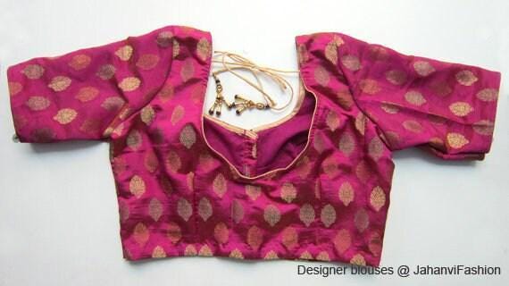 Magenta saree blouse with gold leaf pattern, deep round neckline and short sleeves