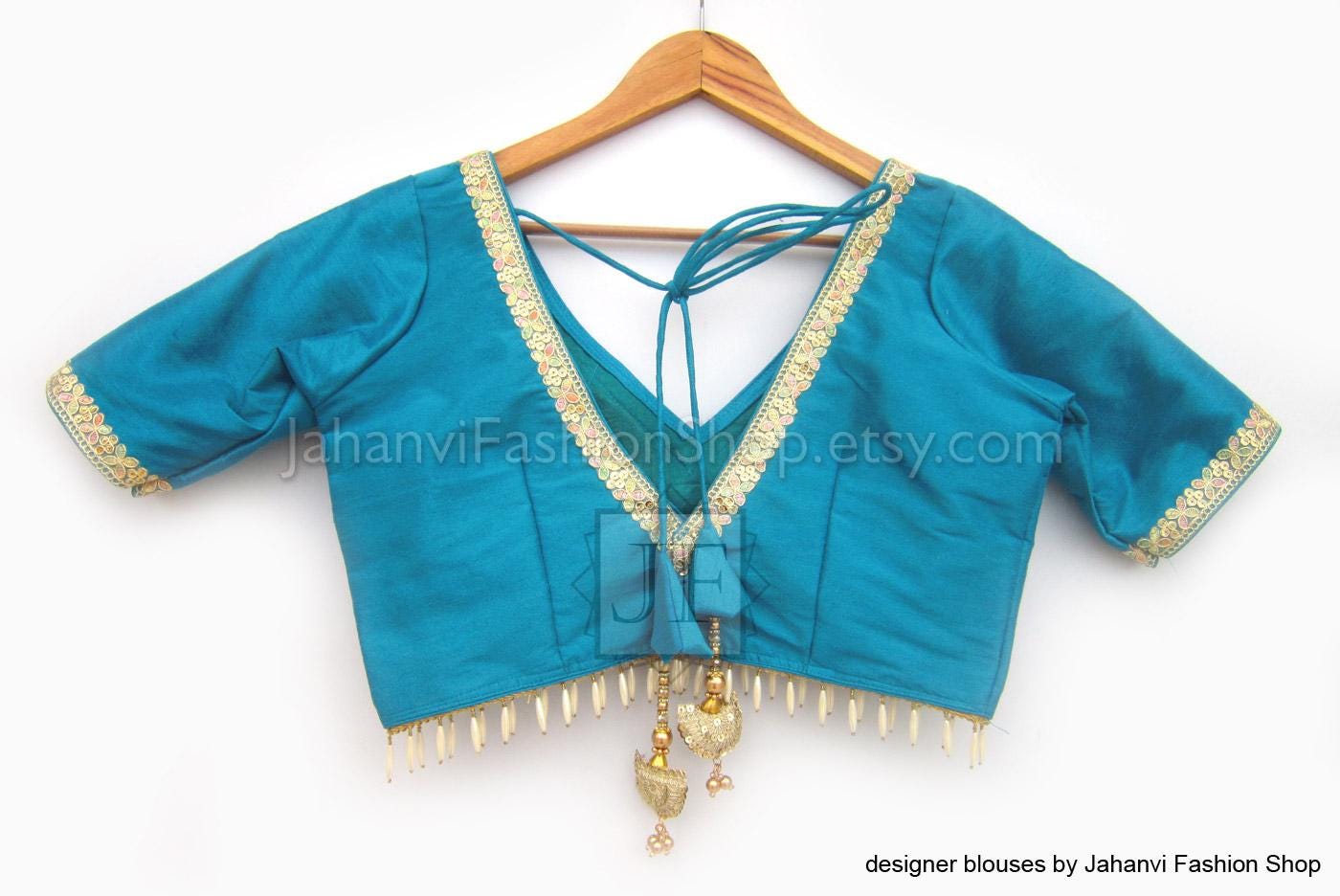 Teal saree blouse top with V-neck, golden lace trim, and short sleeves