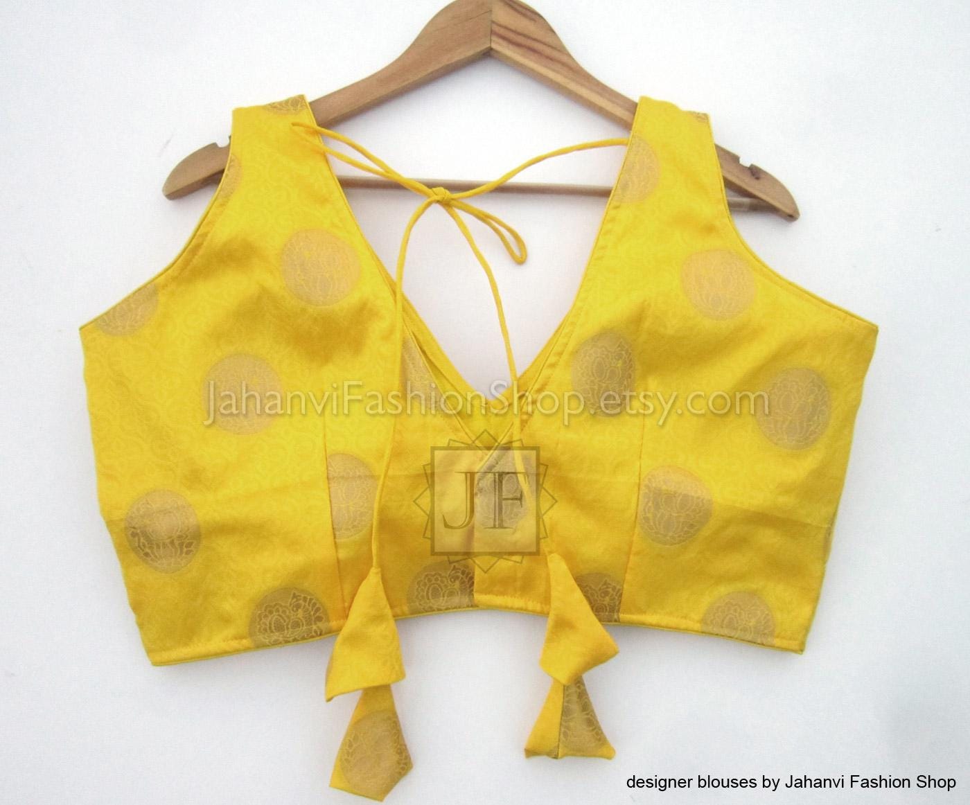 Yellow brocade sleeveless crop top, V-neck with lace-up back strings and dot pattern