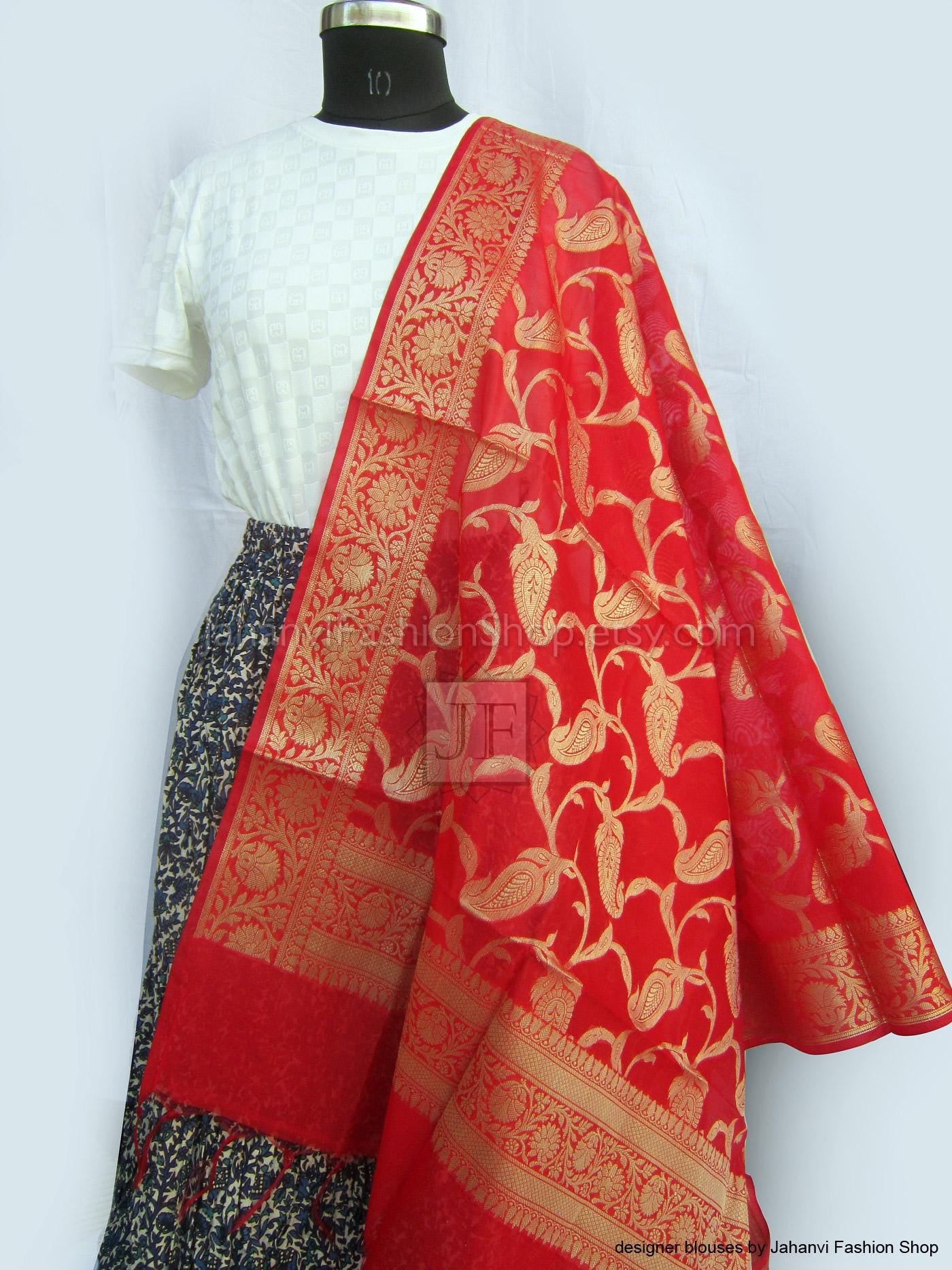 Red silk Banarsi dupatta with gold floral border, draped over shoulder