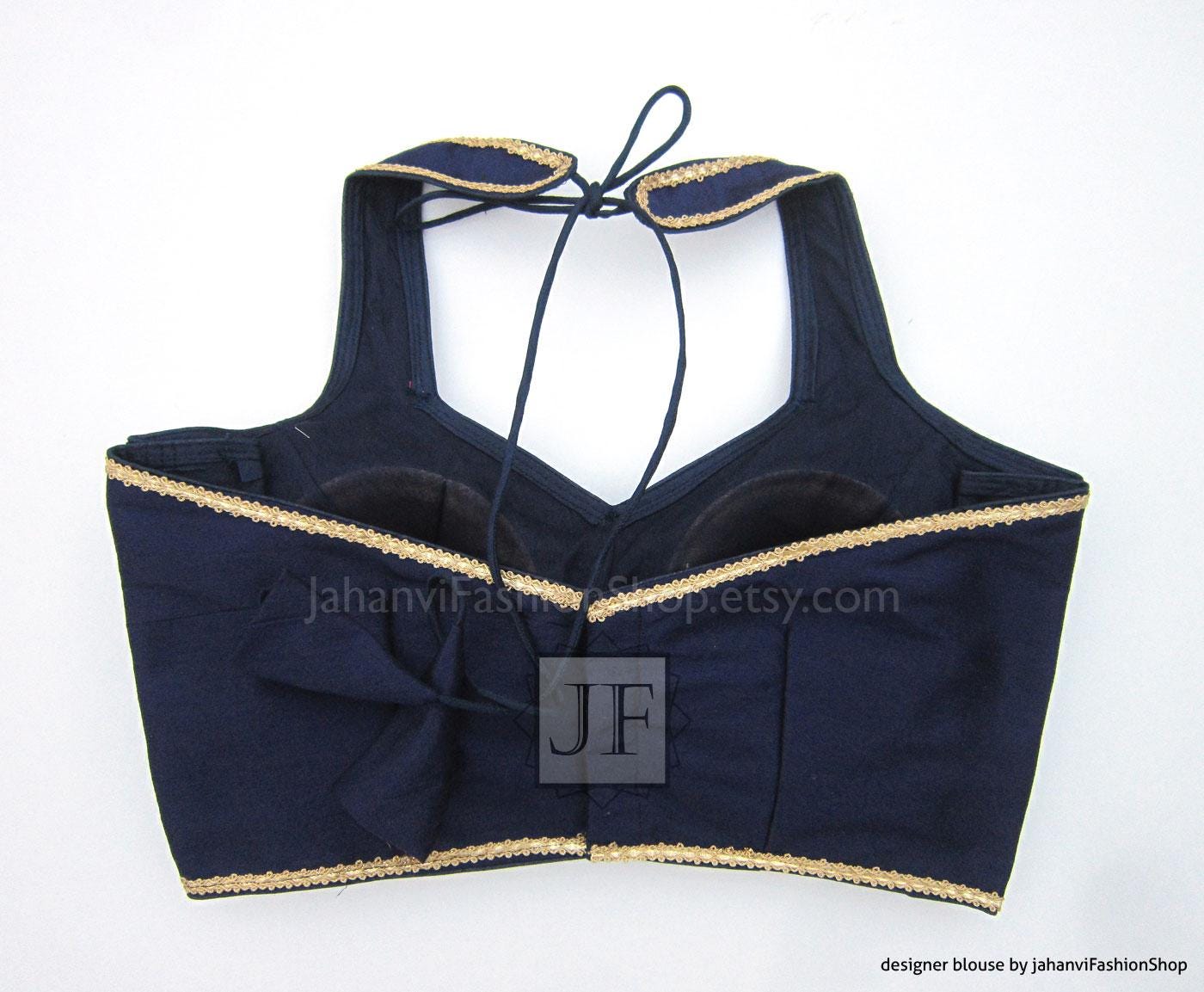 Navy halter neck sleeveless crop blouse with gold trim and front tie strap details