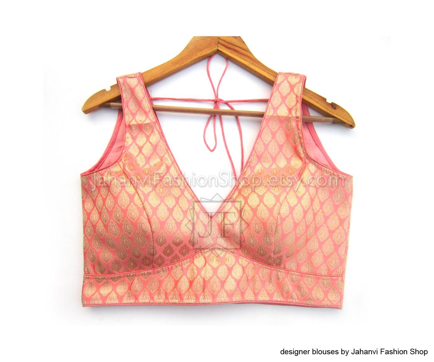 Pink brocade V-neck sleeveless saree blouse with embellished trim and back tie