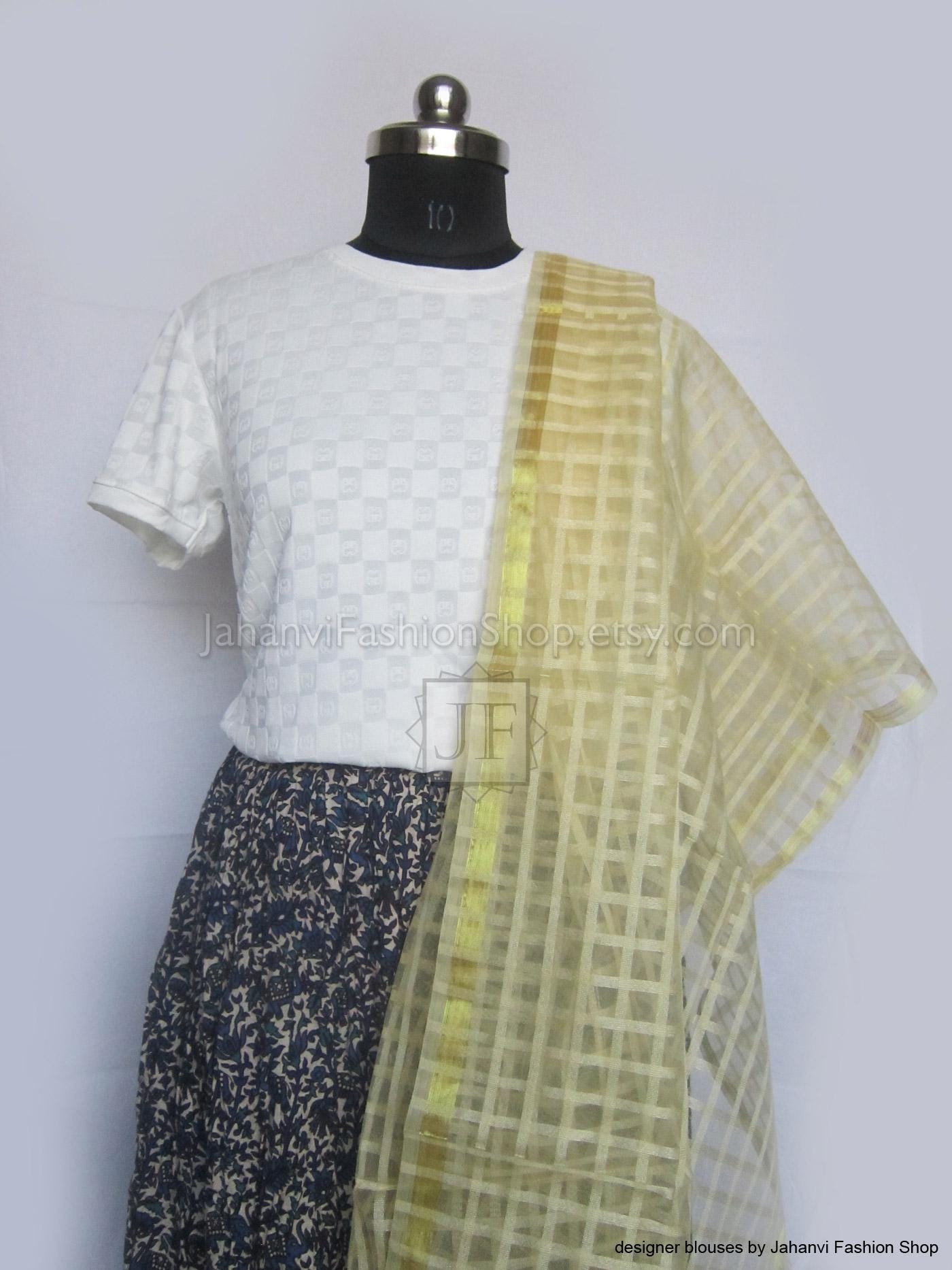 Silk dupatta scarf with pale yellow gold check pattern on sheer fabric, draped on mannequin