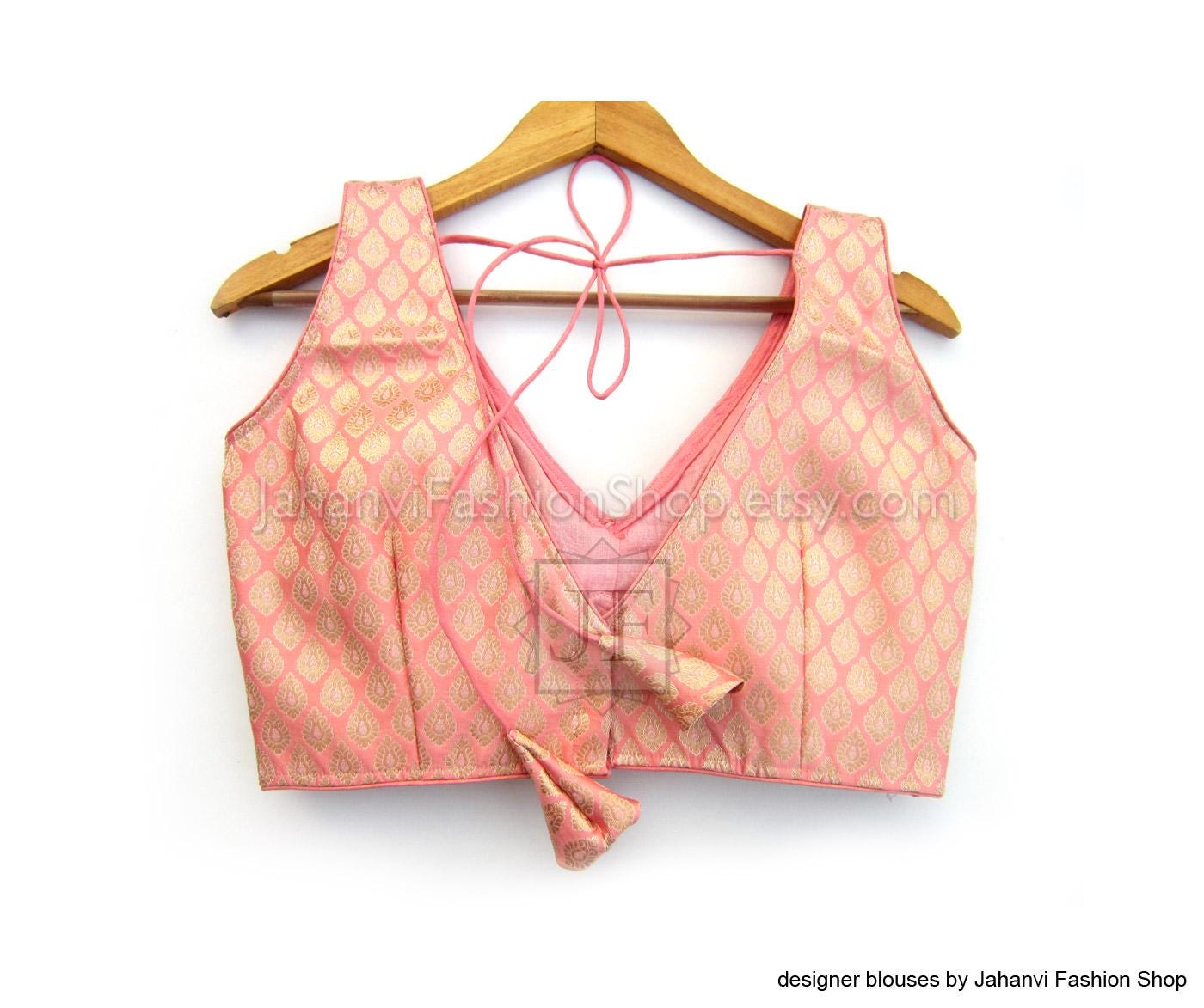 Pink brocade V-neck sleeveless saree blouse with embellished trim and tie straps