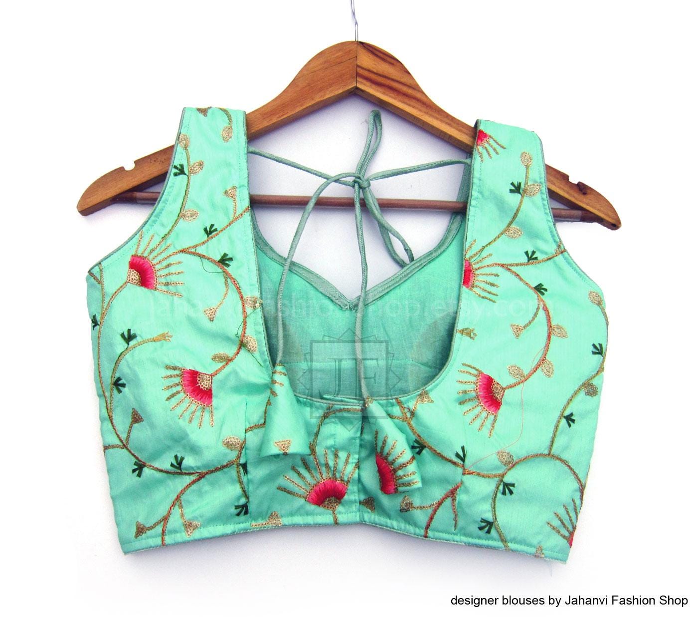 Teal sleeveless crop blouse with sweetheart neckline, floral embroidery, open back tie