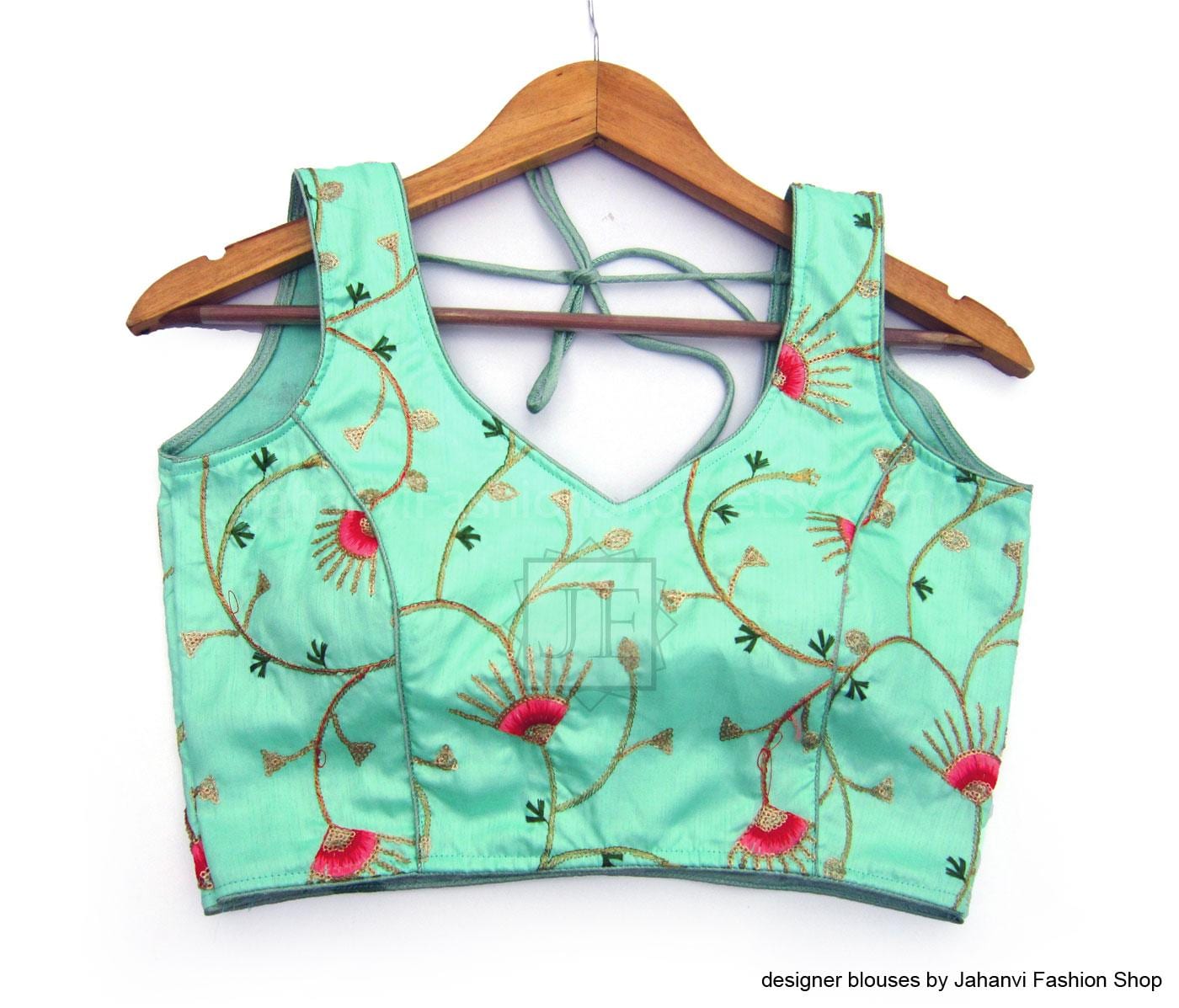 Teal sleeveless crop blouse with sweetheart neckline, floral embroidery