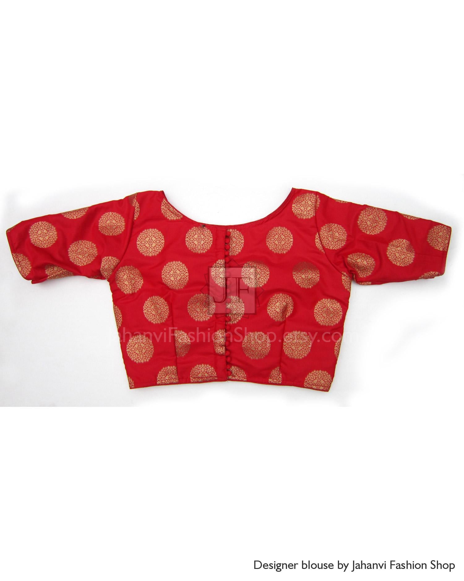 Red boat-neck brocade saree blouse with gold circular motifs, elbow-length sleeves.