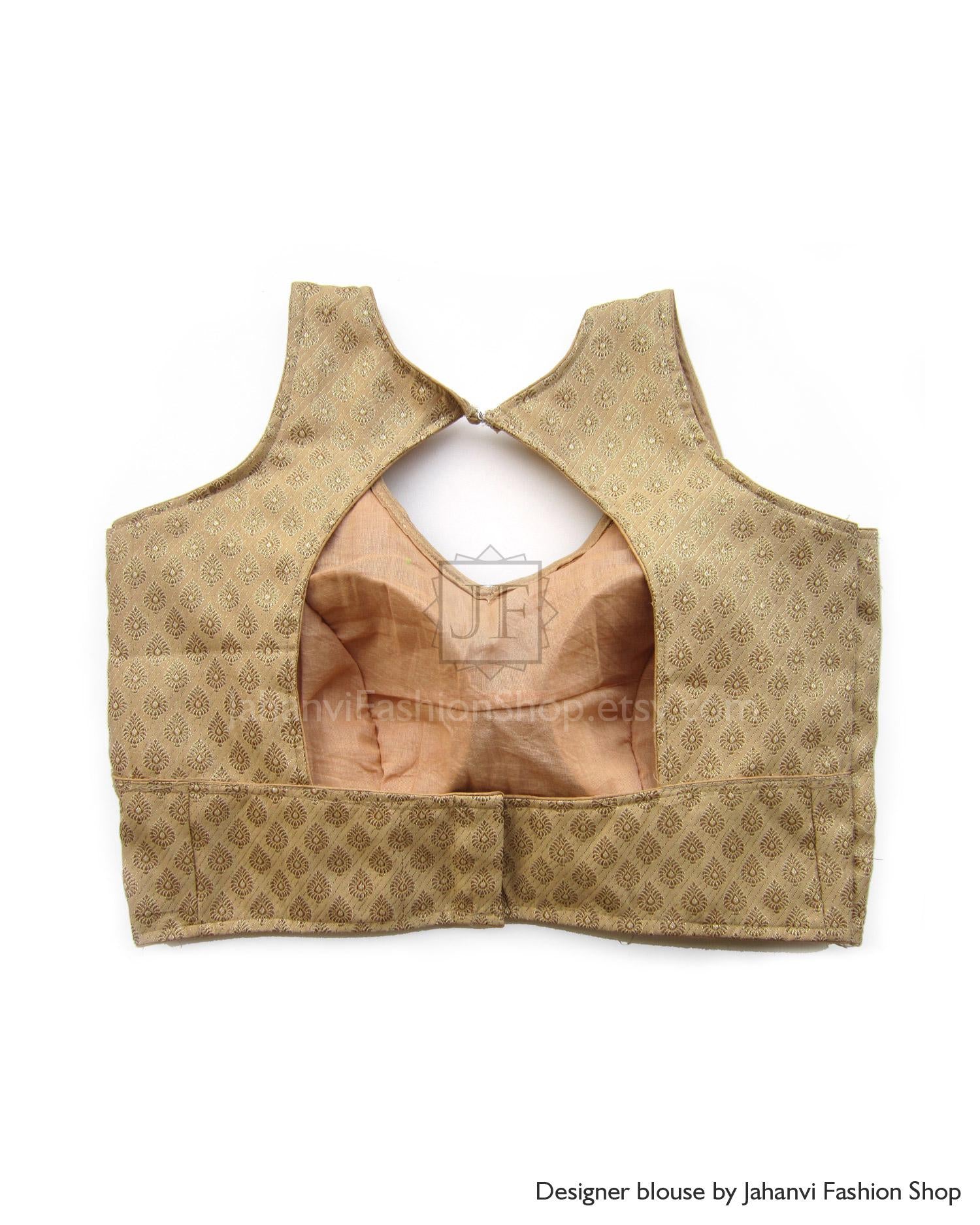 Gold patterned sleeveless saree blouse with keyhole back and hook closure