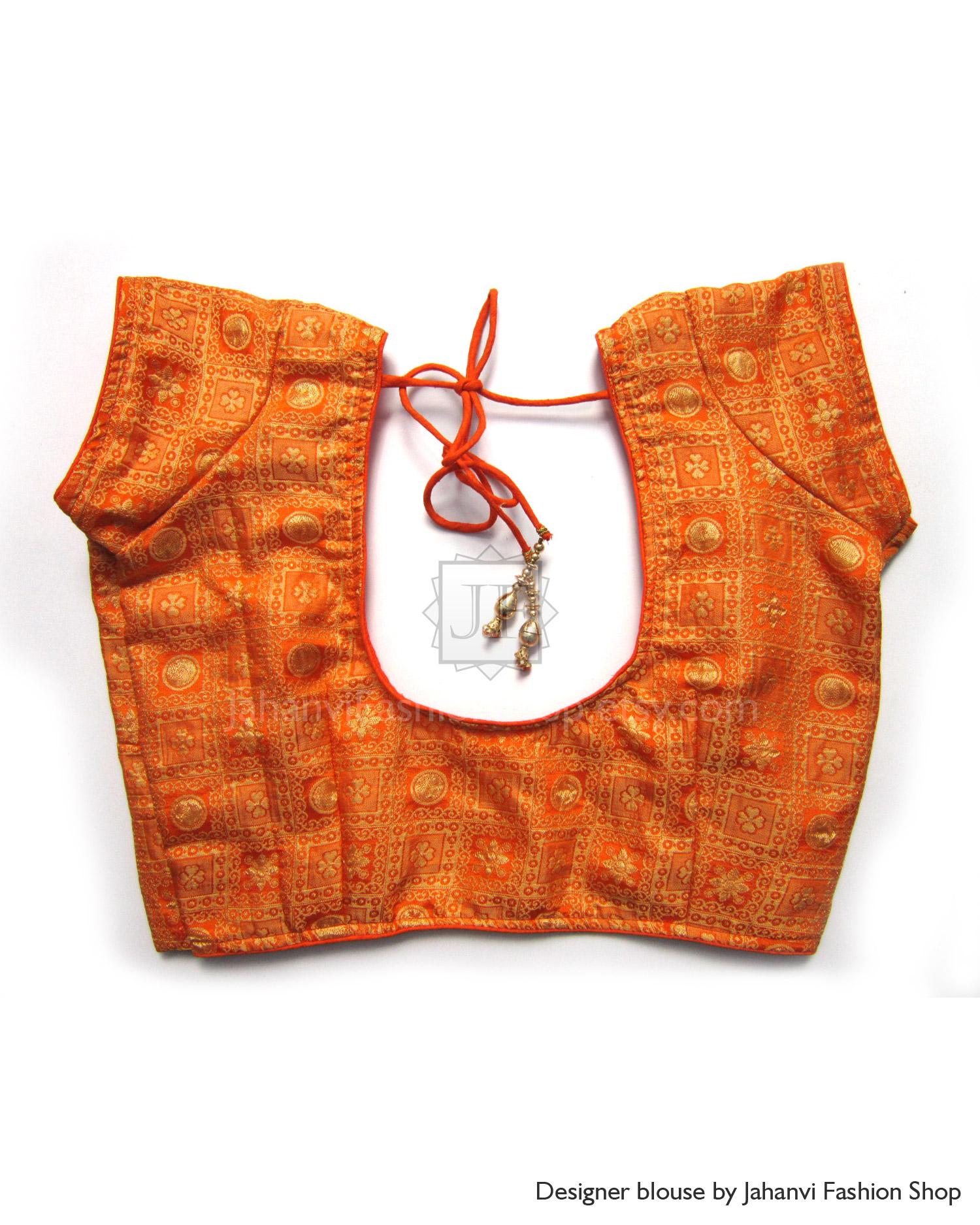 Orange brocade blouse with short sleeves, scalloped V-neck and tie-string detail
