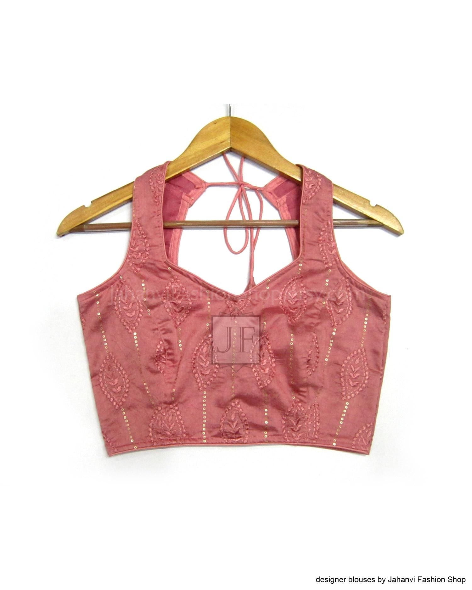 Back view sleeveless V-neck saree blouse in dusty rose with shimmering beadwork straps