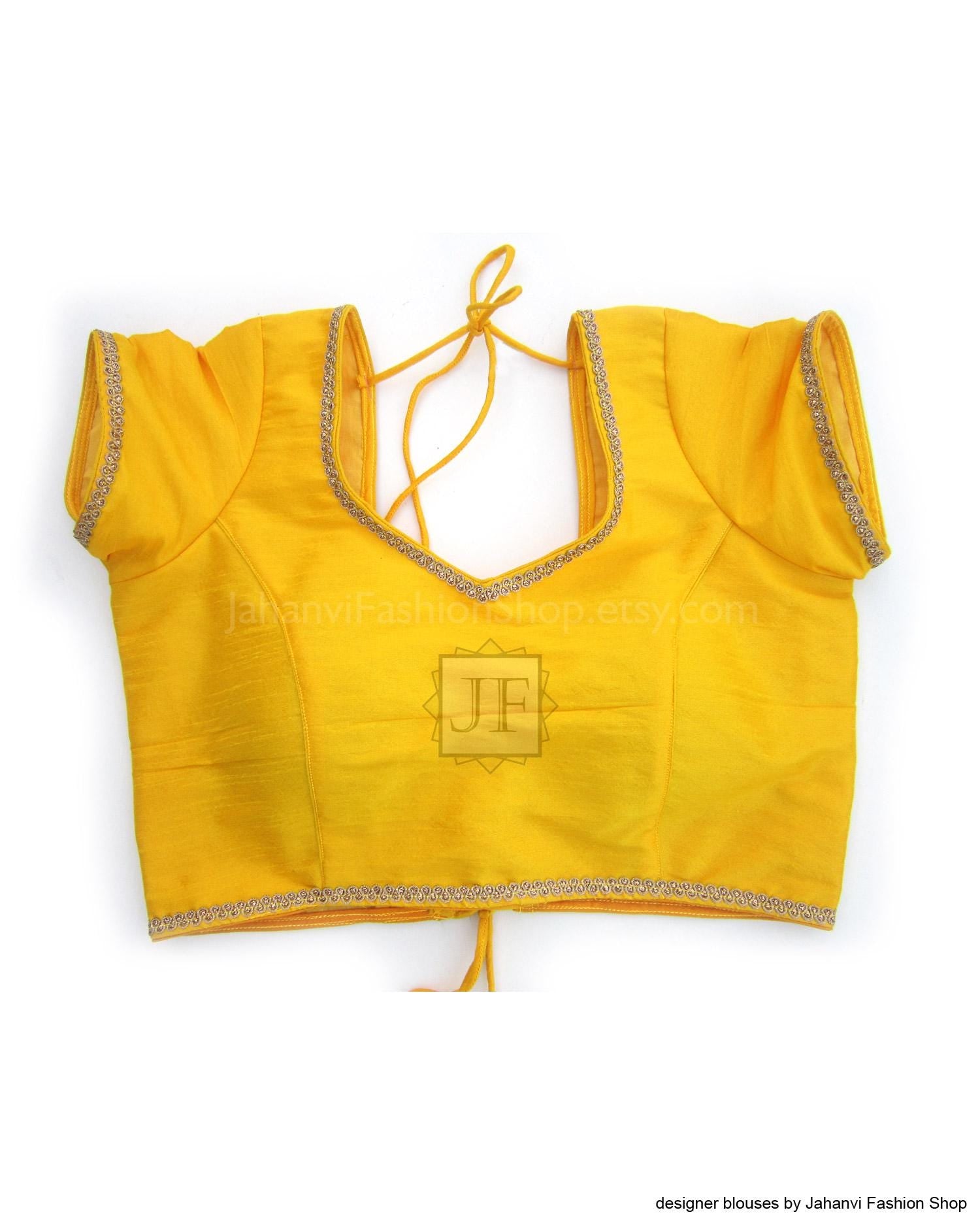 Yellow saree blouse crop top with tie-up neckline and golden-trim edges