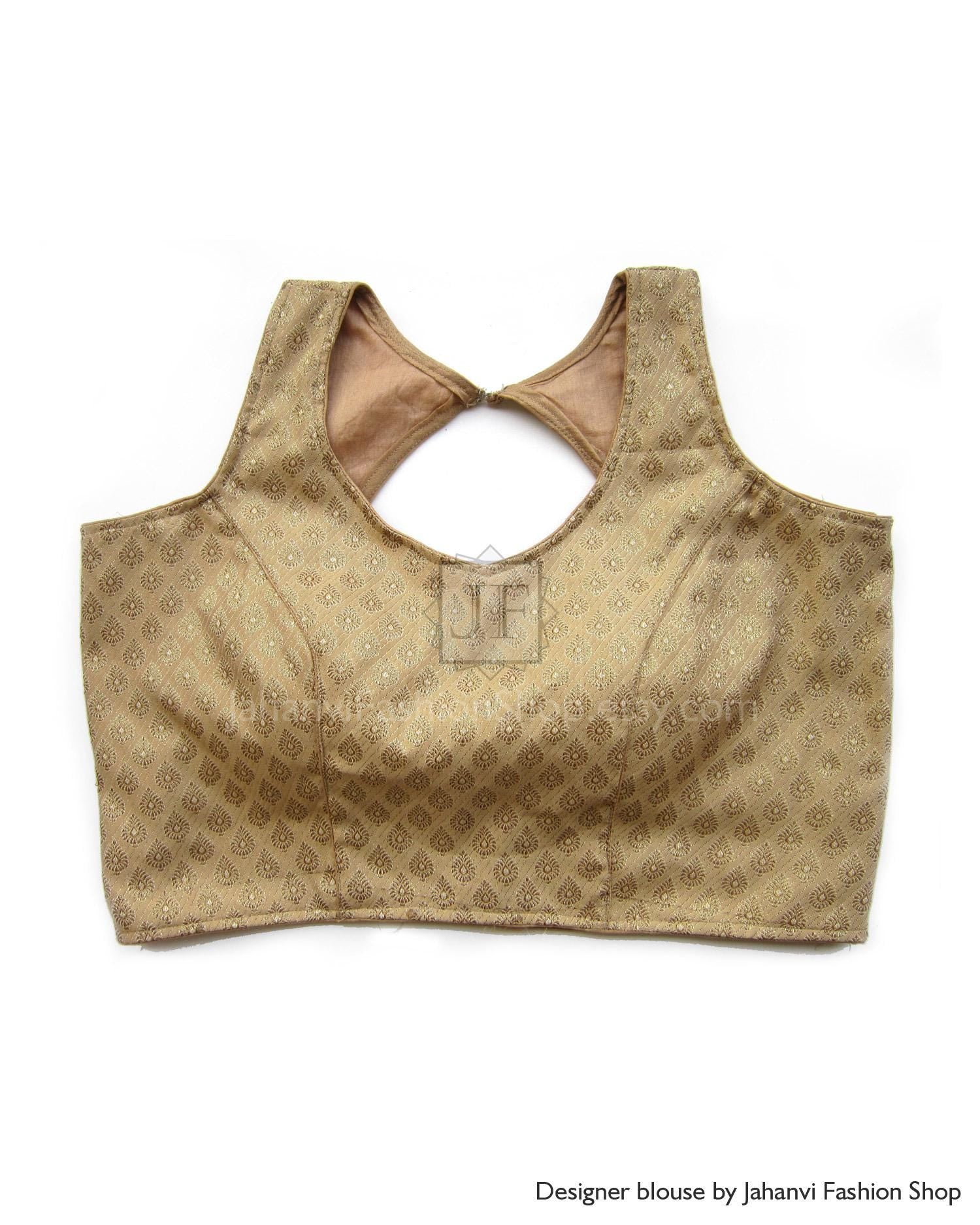 Gold patterned sleeveless saree blouse with keyhole back cutout and hook closure