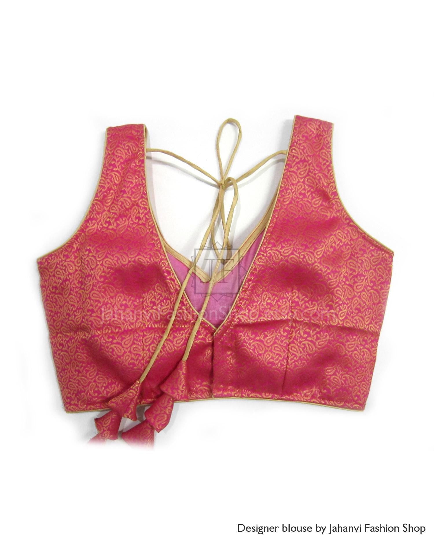 Pink V-neck saree blouse with crisscross tie-back strings and patterned fabric