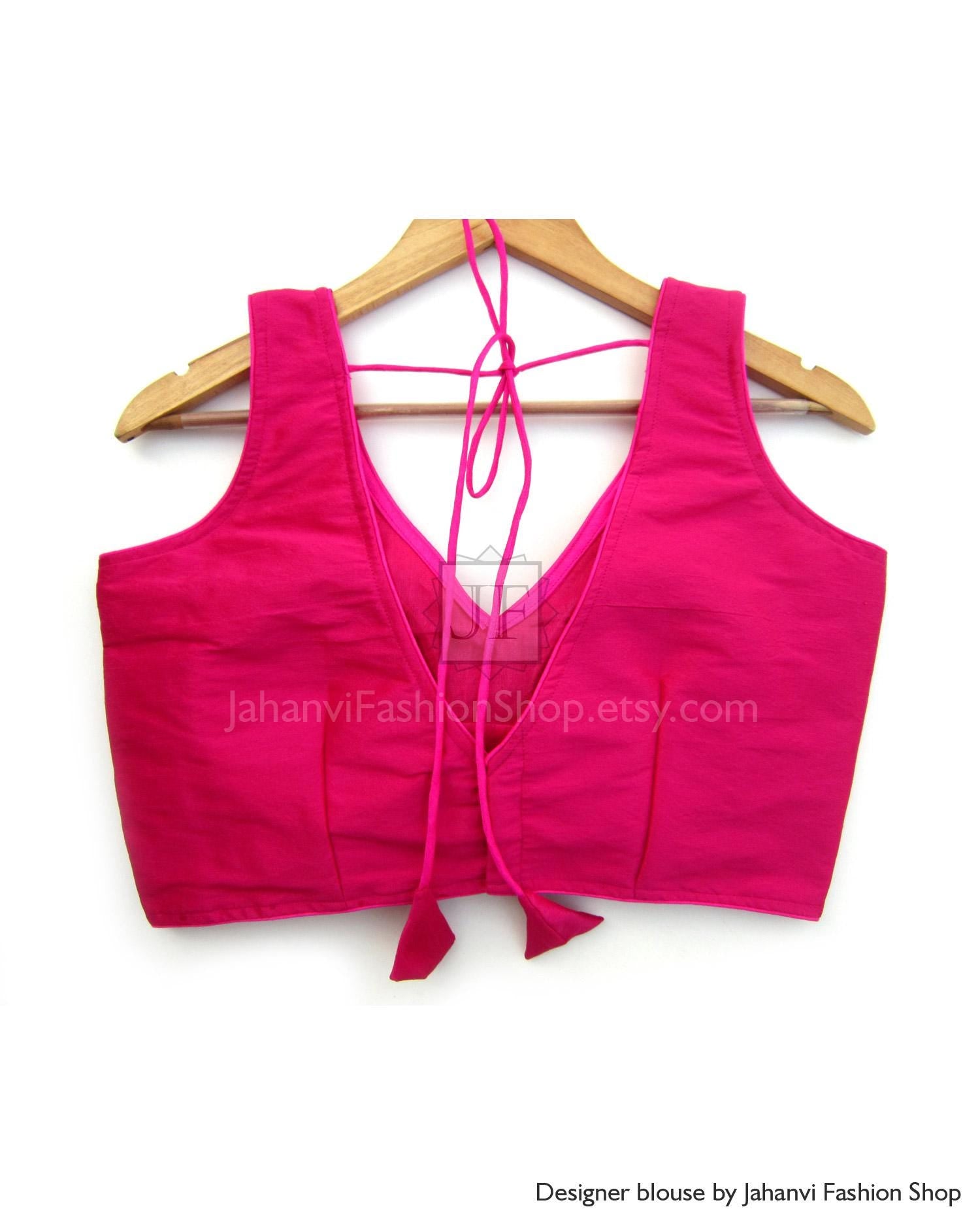 Magenta sleeveless V-neck saree blouse with adjustable tie-up back strings