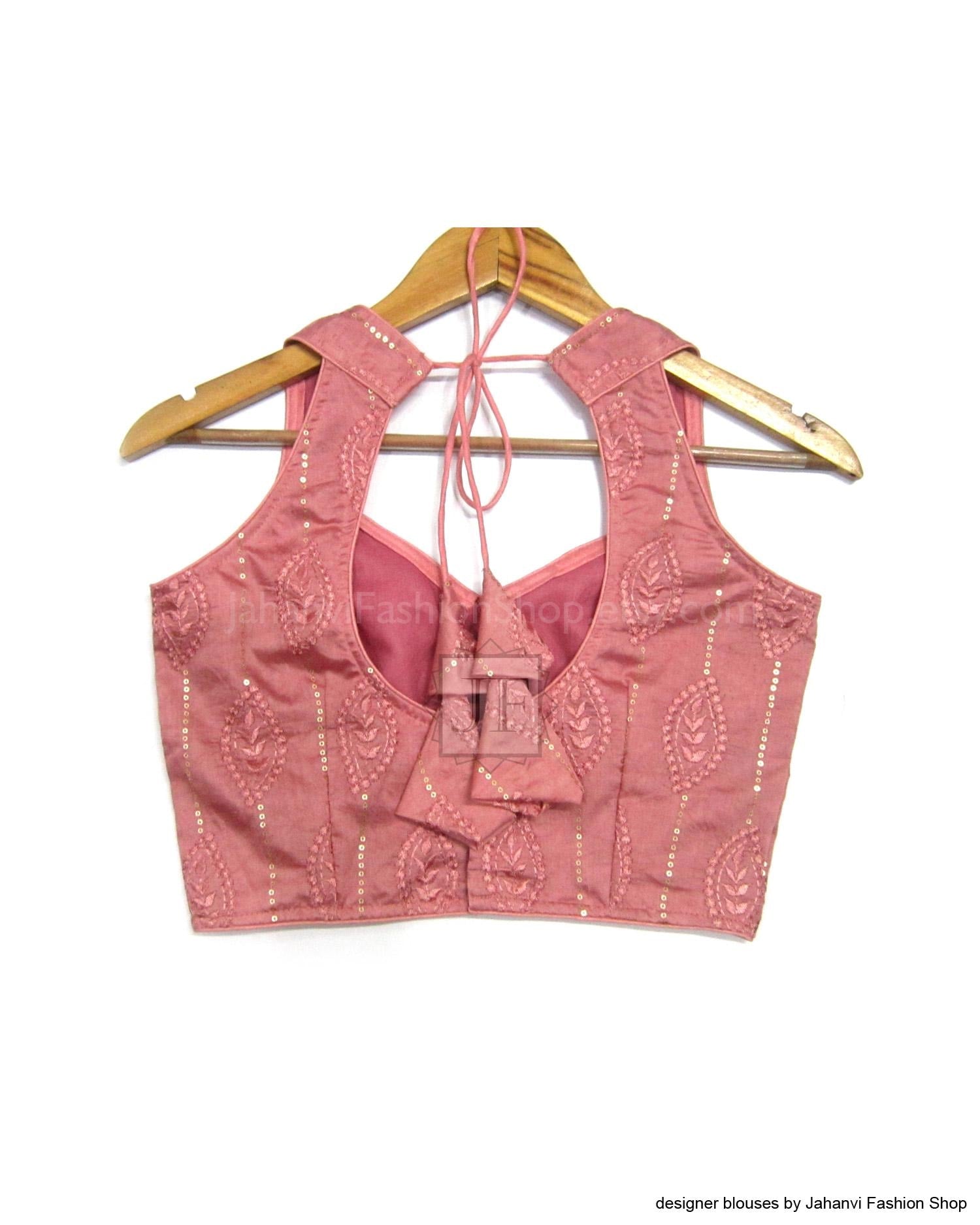 Sleeveless V-neck saree blouse in dusty rose with shimmering beadwork and tie-back