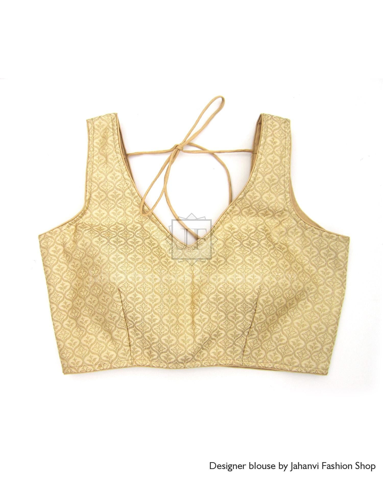 Pale gold sleeveless padded saree blouse with V-neck and open back tie straps