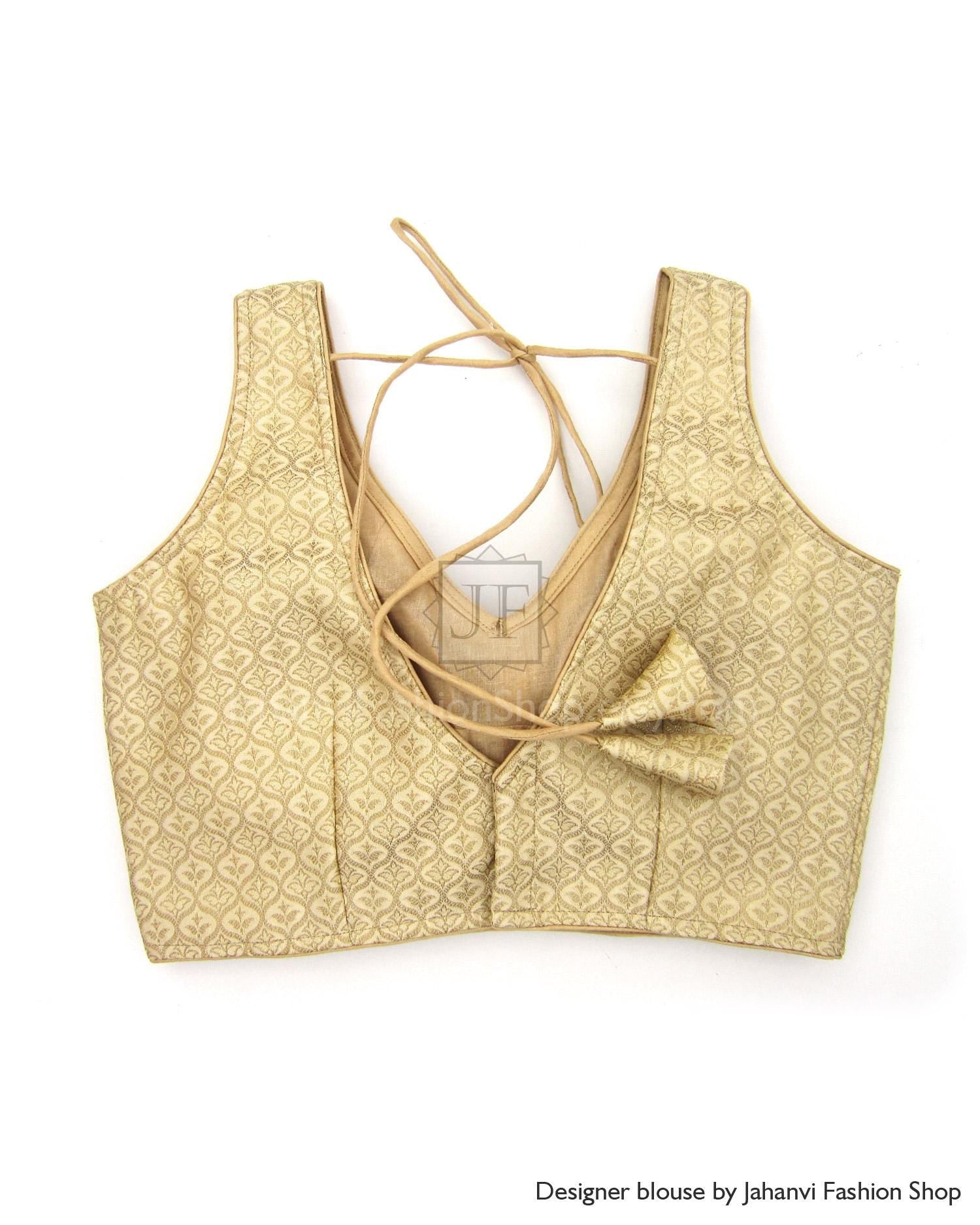 Pale gold sleeveless saree blouse with V-neck open back and crossed tie straps