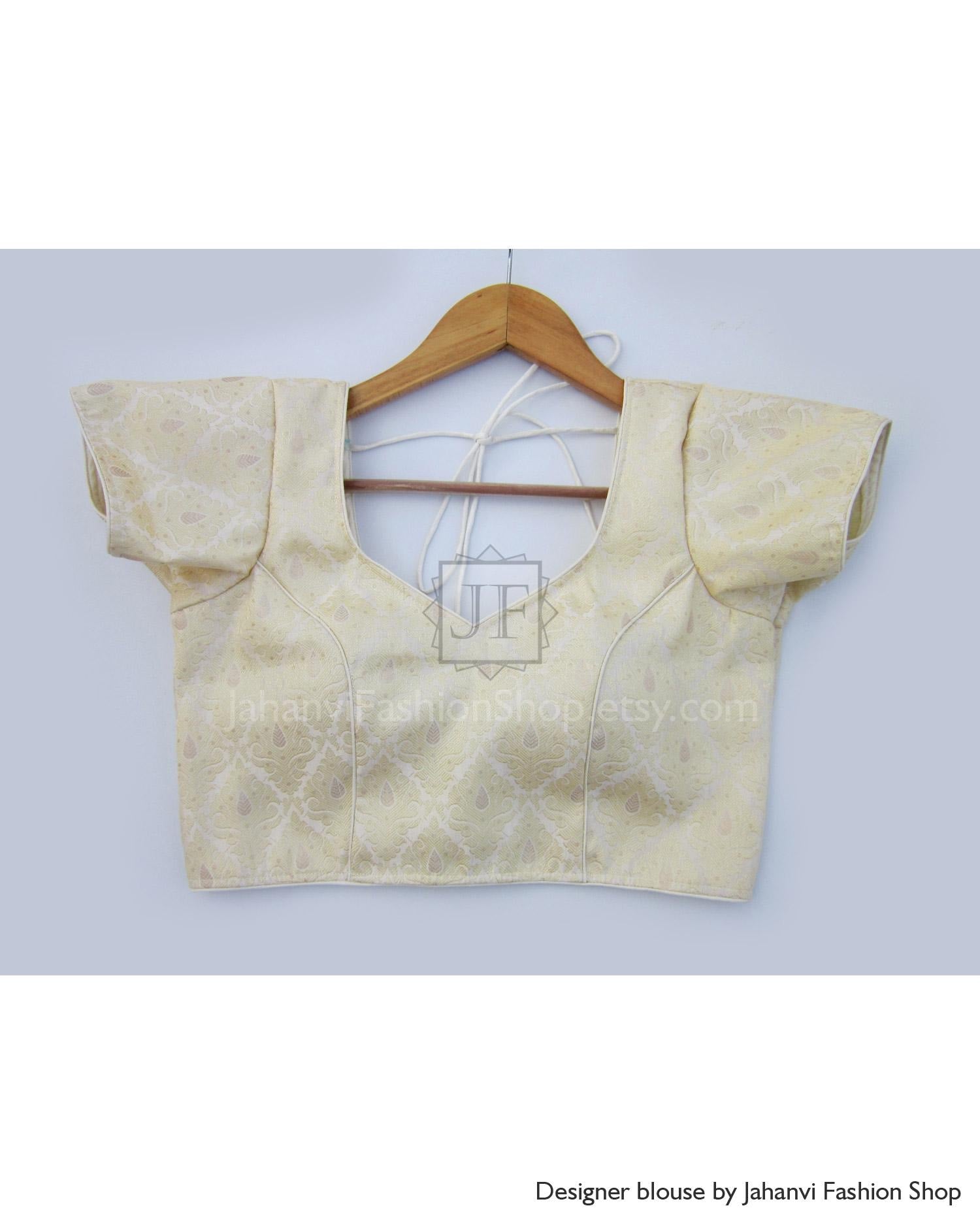 Cream gold short-sleeve saree blouse with V back and stitched pattern