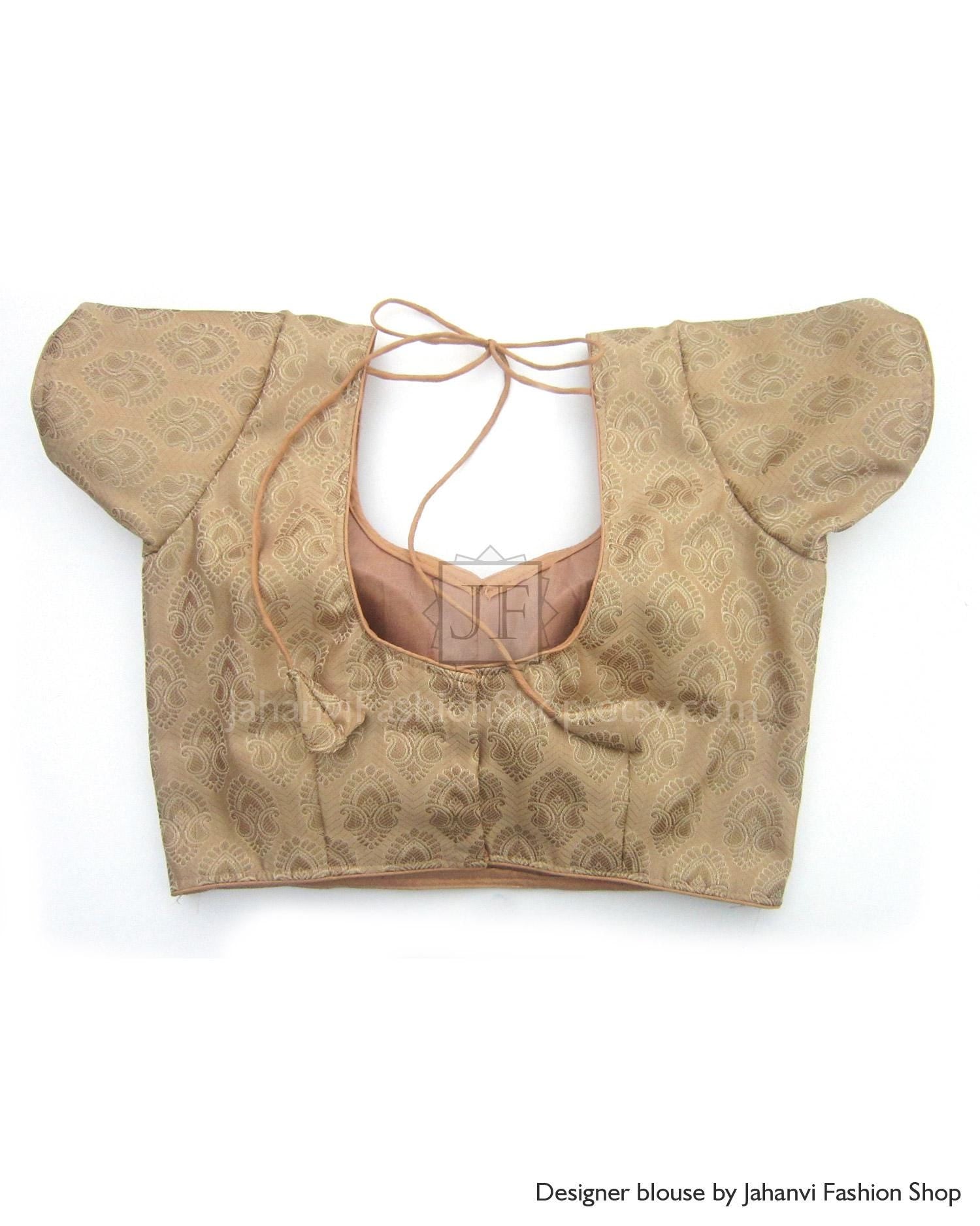 Golden beige patterned saree blouse crop top with tied back strap and short puff sleeves
