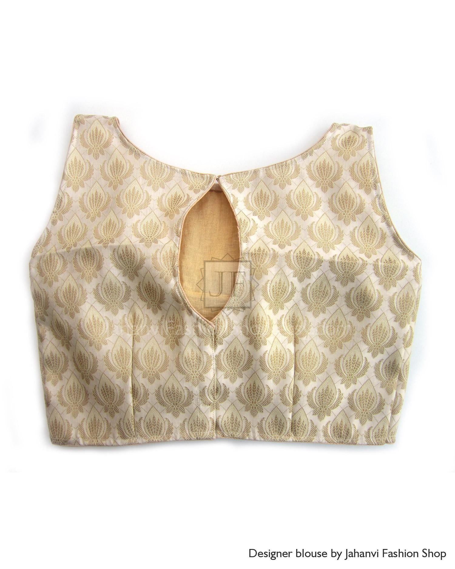 Back view of sleeveless saree blouse, boat neck, keyhole back closure, gold leaf print