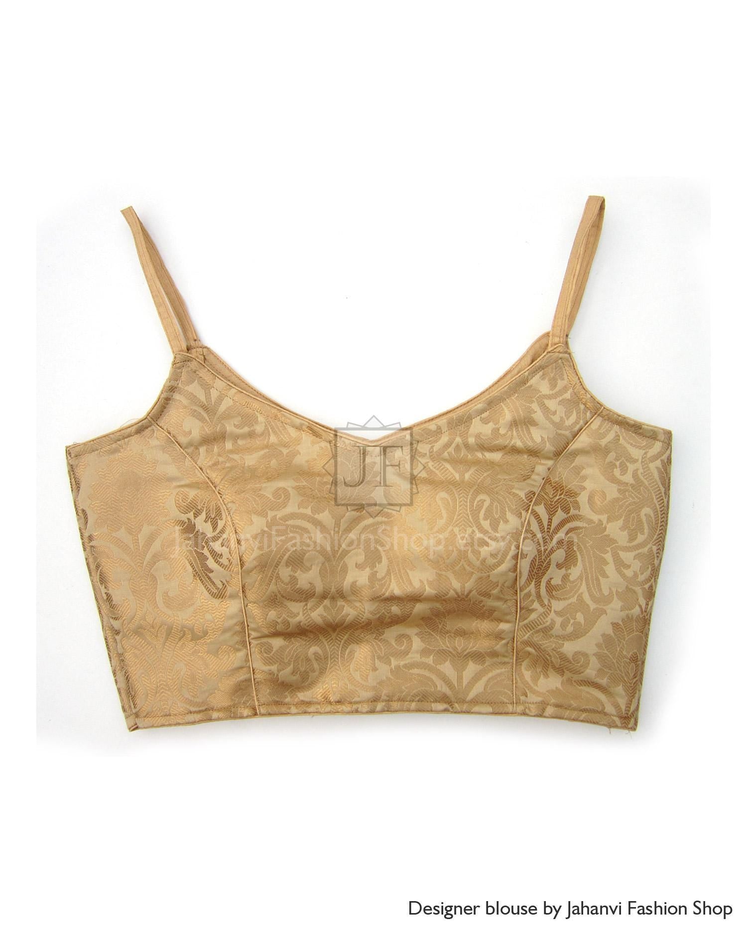 Golden brocade saree blouse with spaghetti straps, princess seams, back V opening