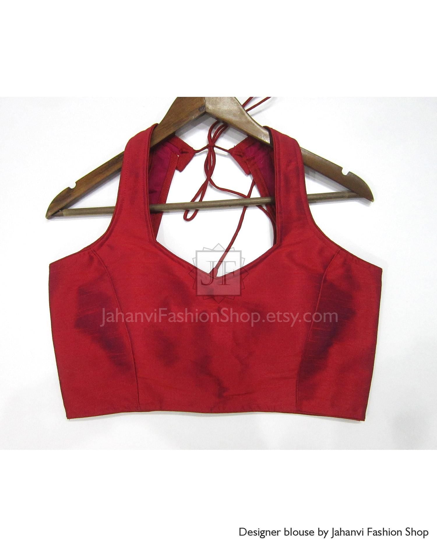 Red halter neck sleeveless saree blouse, backless tie straps, on hanger
