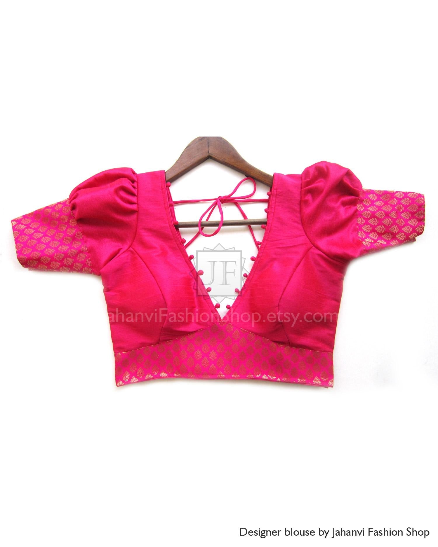 Magenta V-neck Indian saree blouse with short puff sleeves, lace trim, and tie-back straps