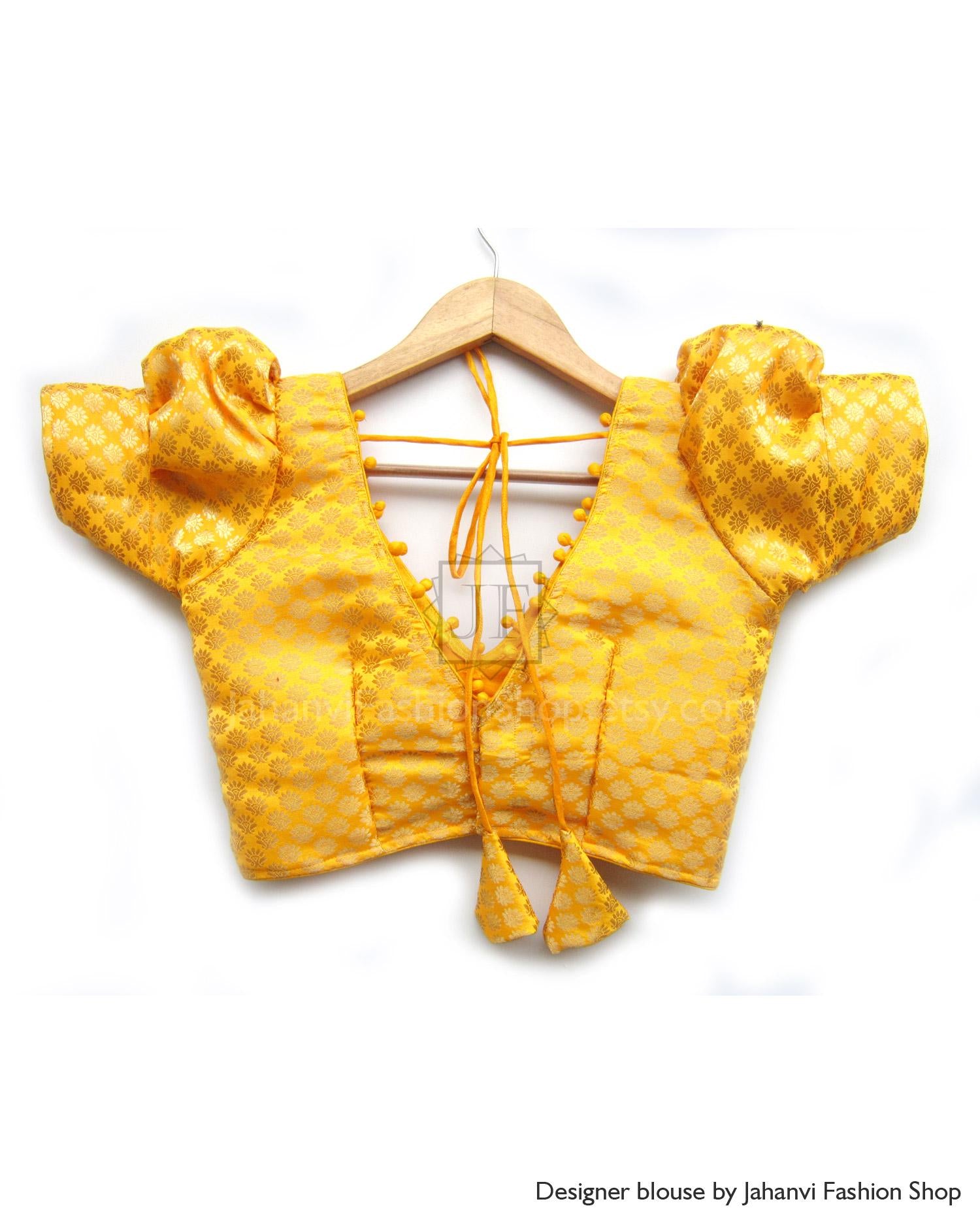 Mustard-yellow saree blouse with puff sleeves and V-neck, back hanging tie strings