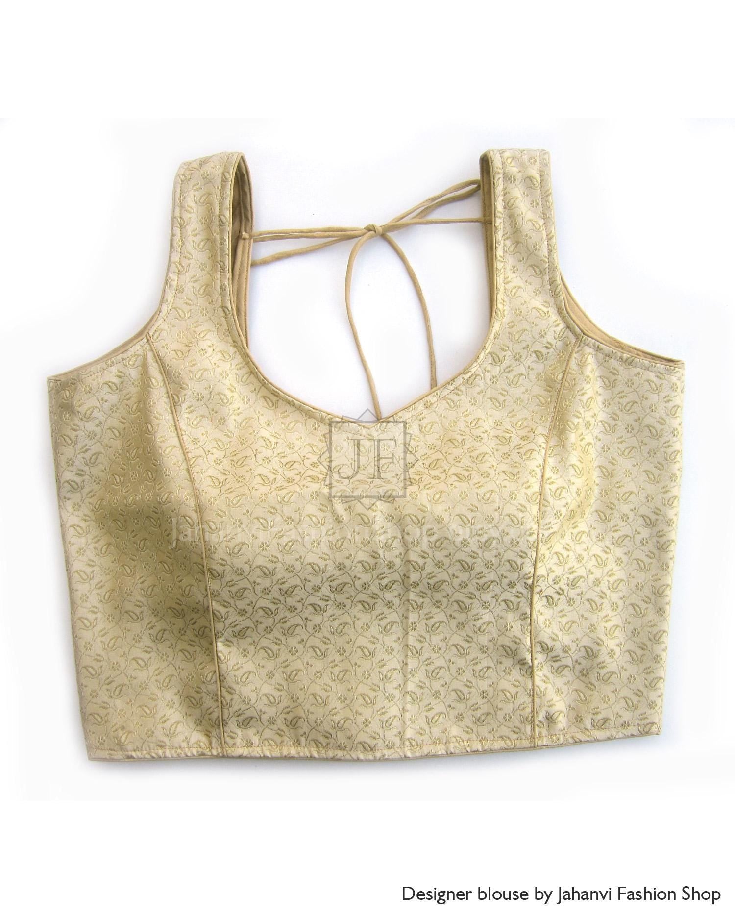 Golden sleeveless designer blouse with round neckline and back tie strap cutout