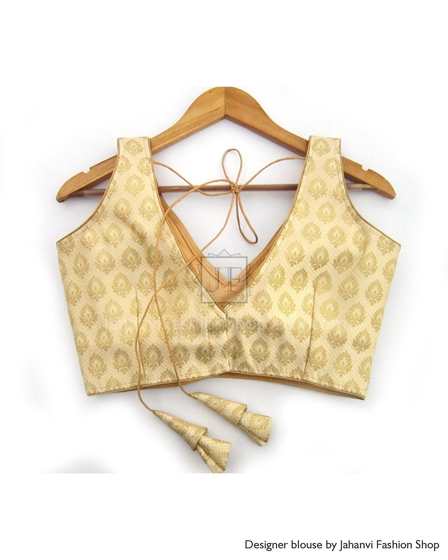 Golden brocade saree blouse with V-neck front and tied back strings, sleeveless design