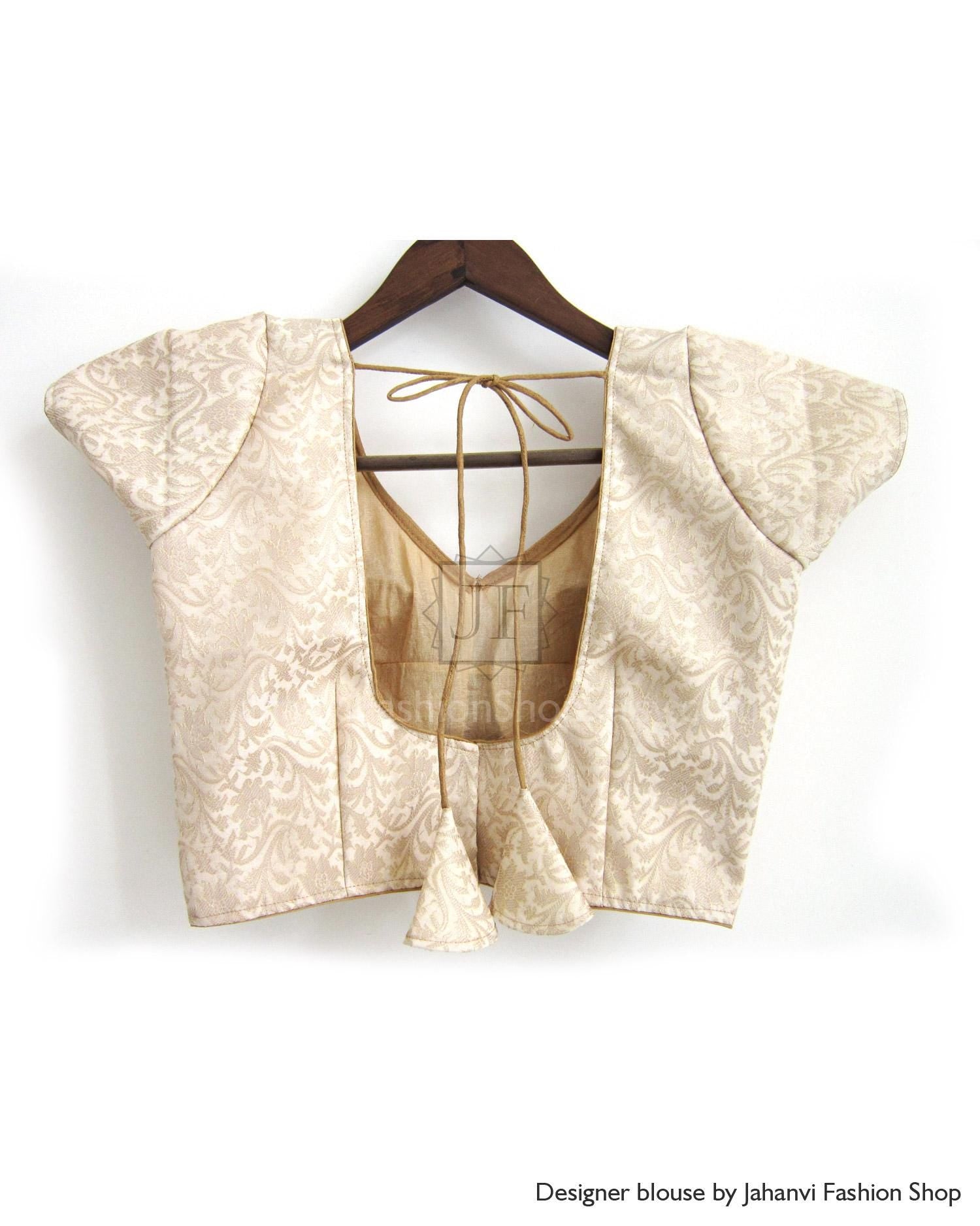 Golden brocade saree blouse with open back and tie strings, short flared sleeves