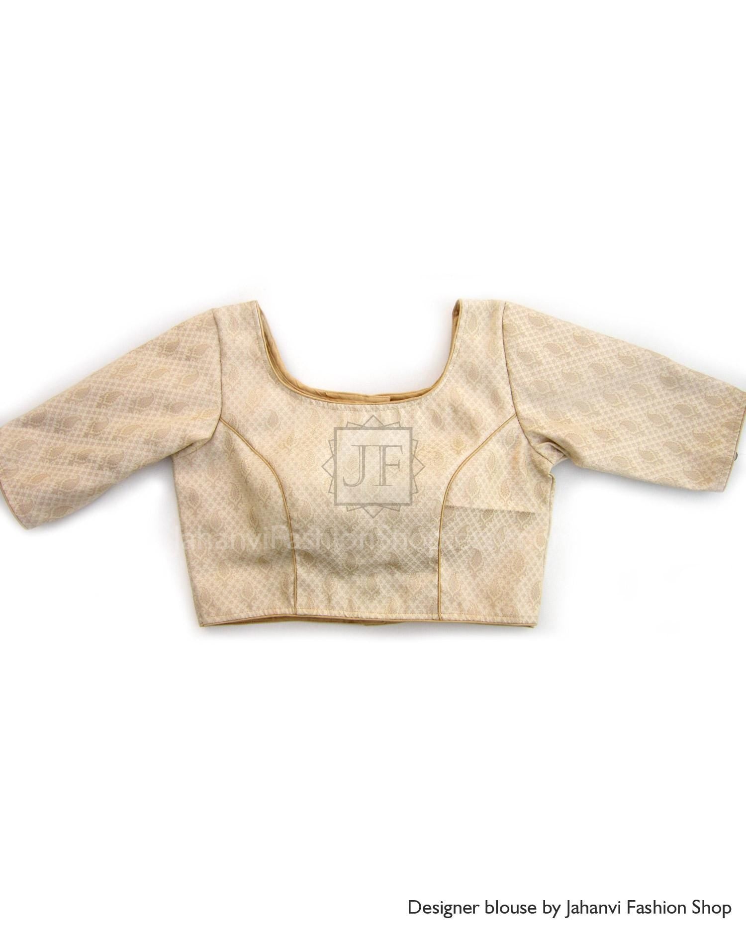 Gold-tone saree blouse with quarter sleeves, boat neckline, textured fabric