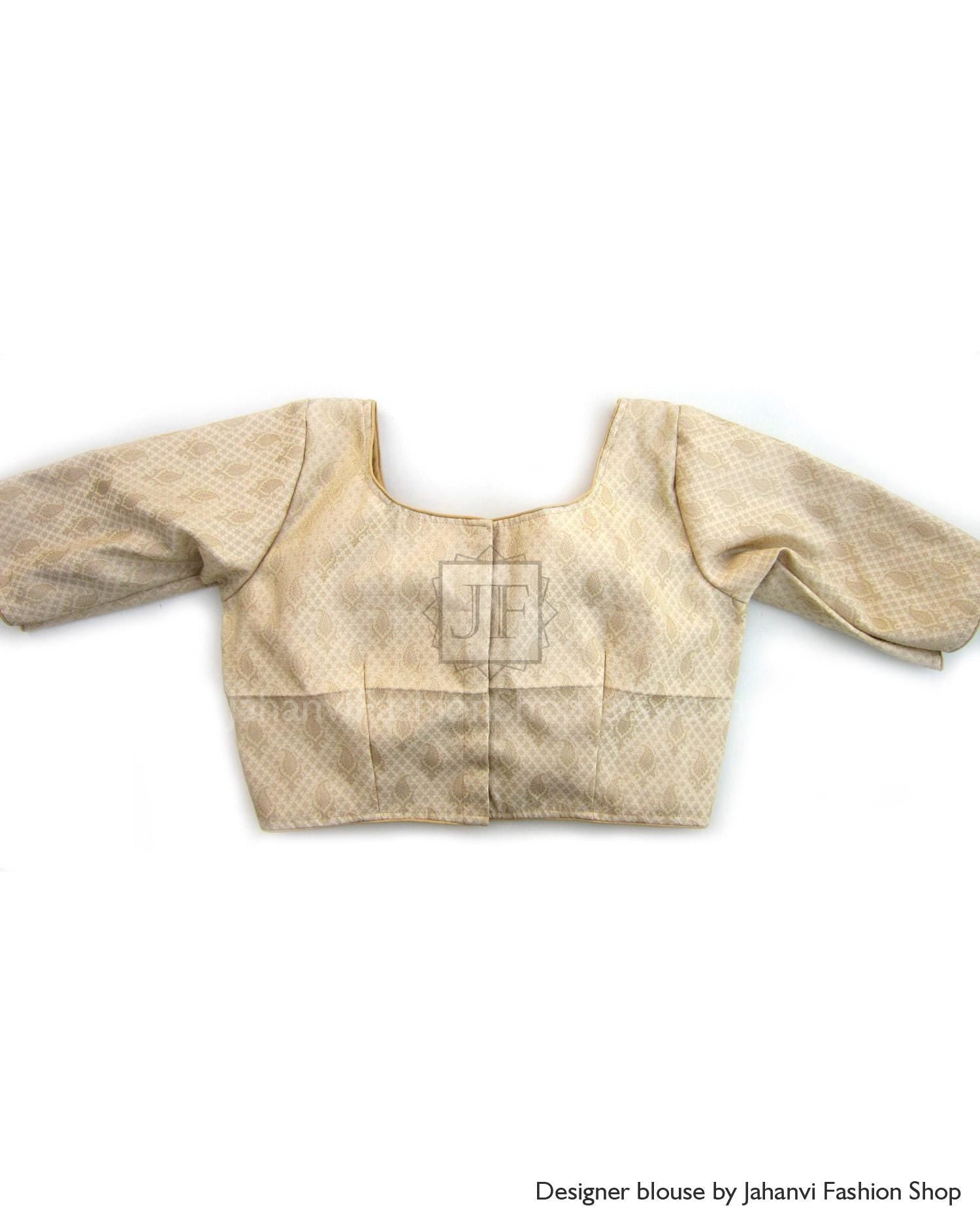 Gold-tone saree blouse with quarter sleeves and center panel detail, textured fabric