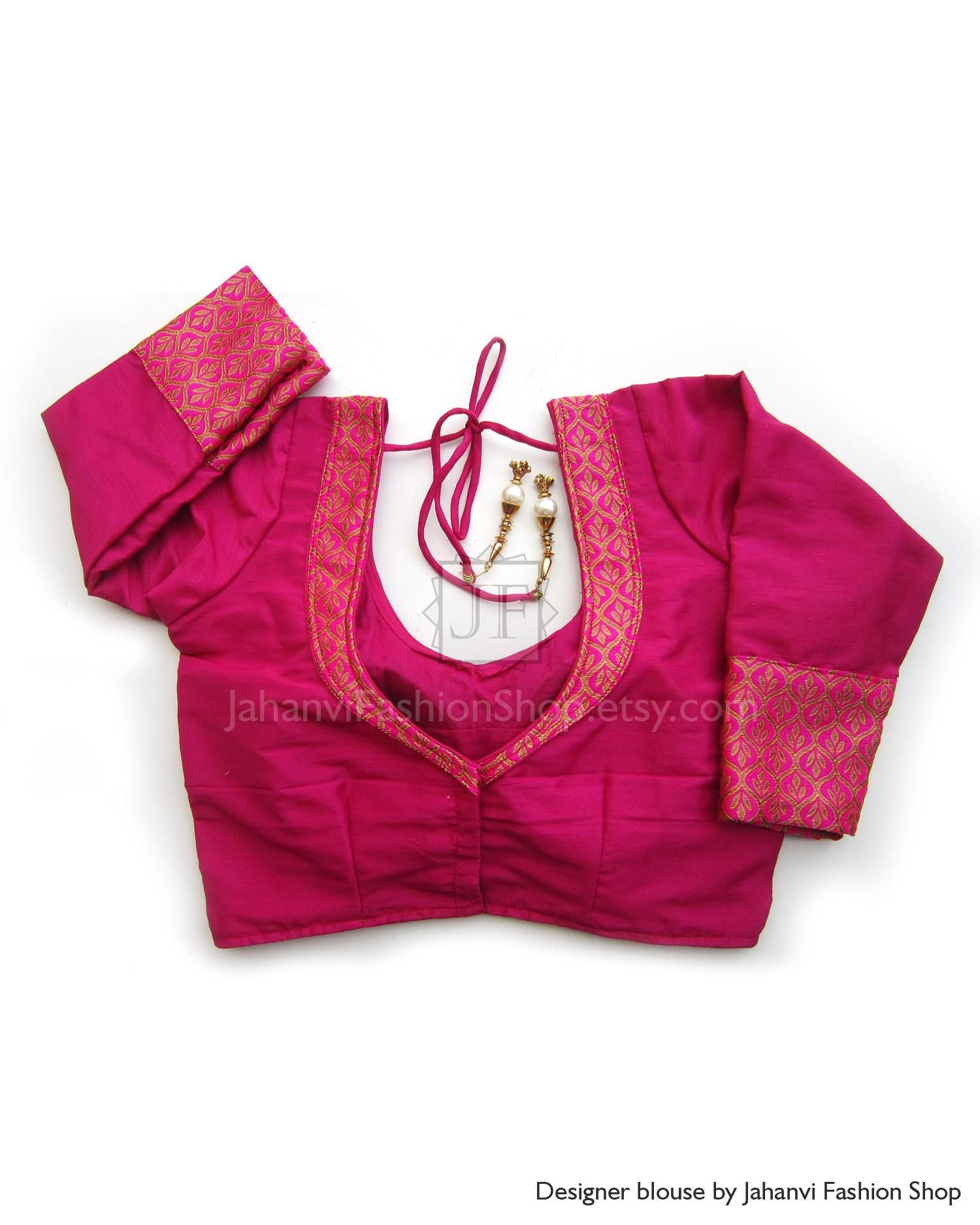 Magenta bridal saree blouse with princess-cut panels and brocade back detail