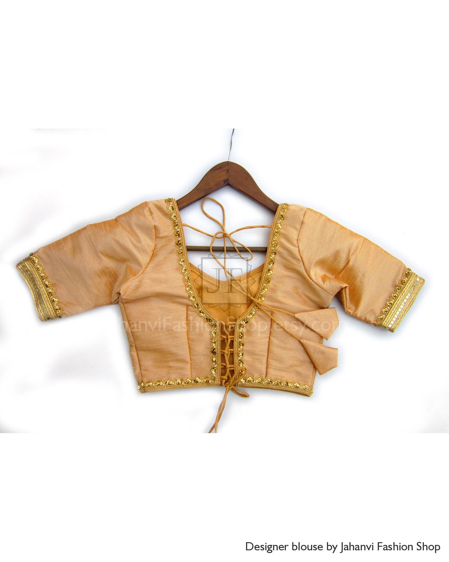 Beige saree blouse with gold lace border, crisscross tie back, short sleeves