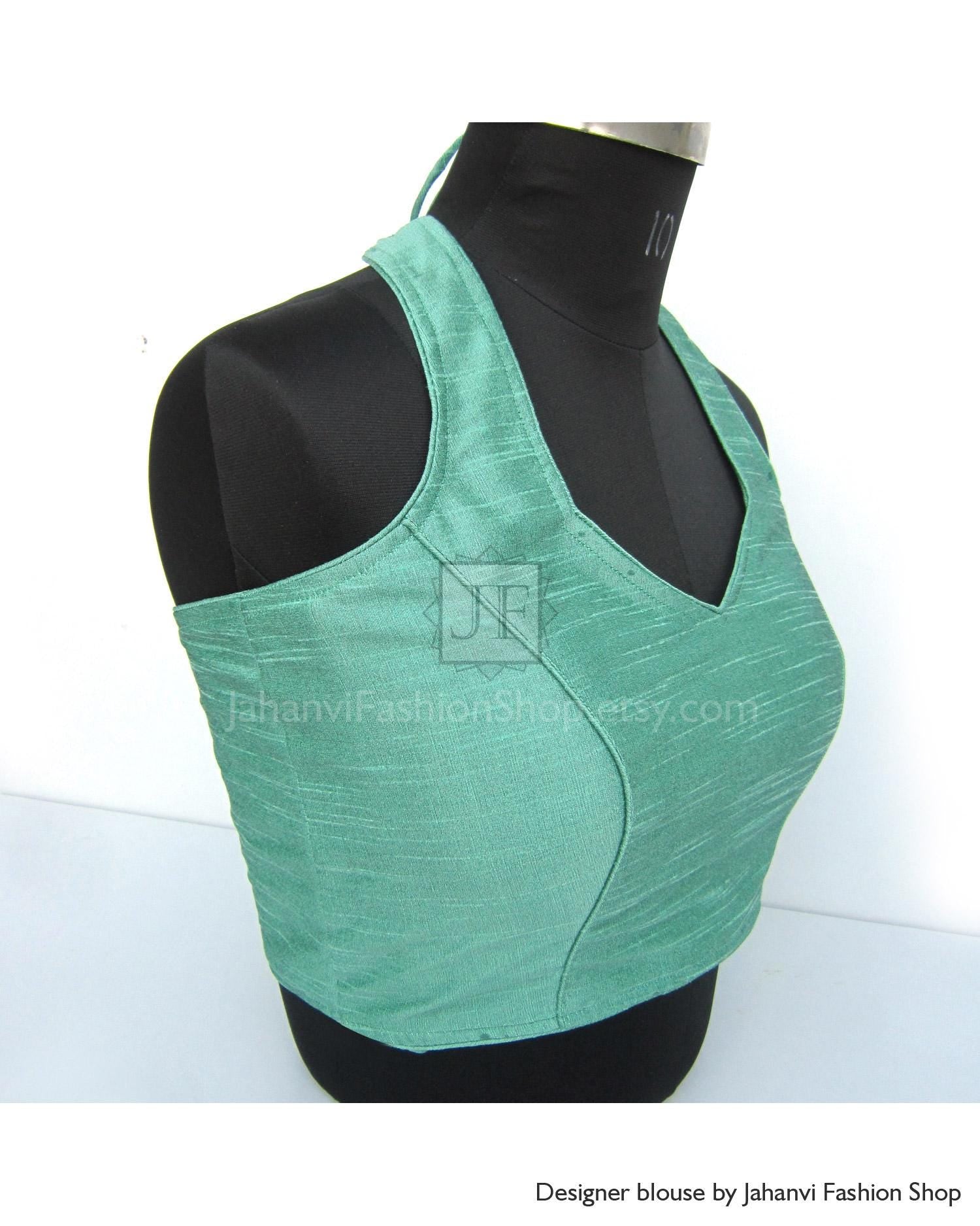 Turquoise halter neck saree blouse with princess cut seams, back open style