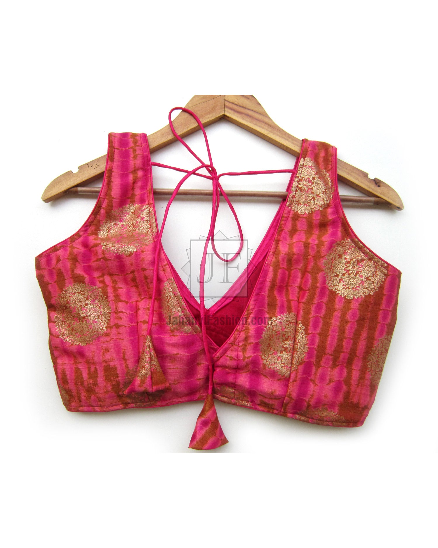 Magenta V-neck sleeveless saree blouse with gold brocade panels, tie-front strings