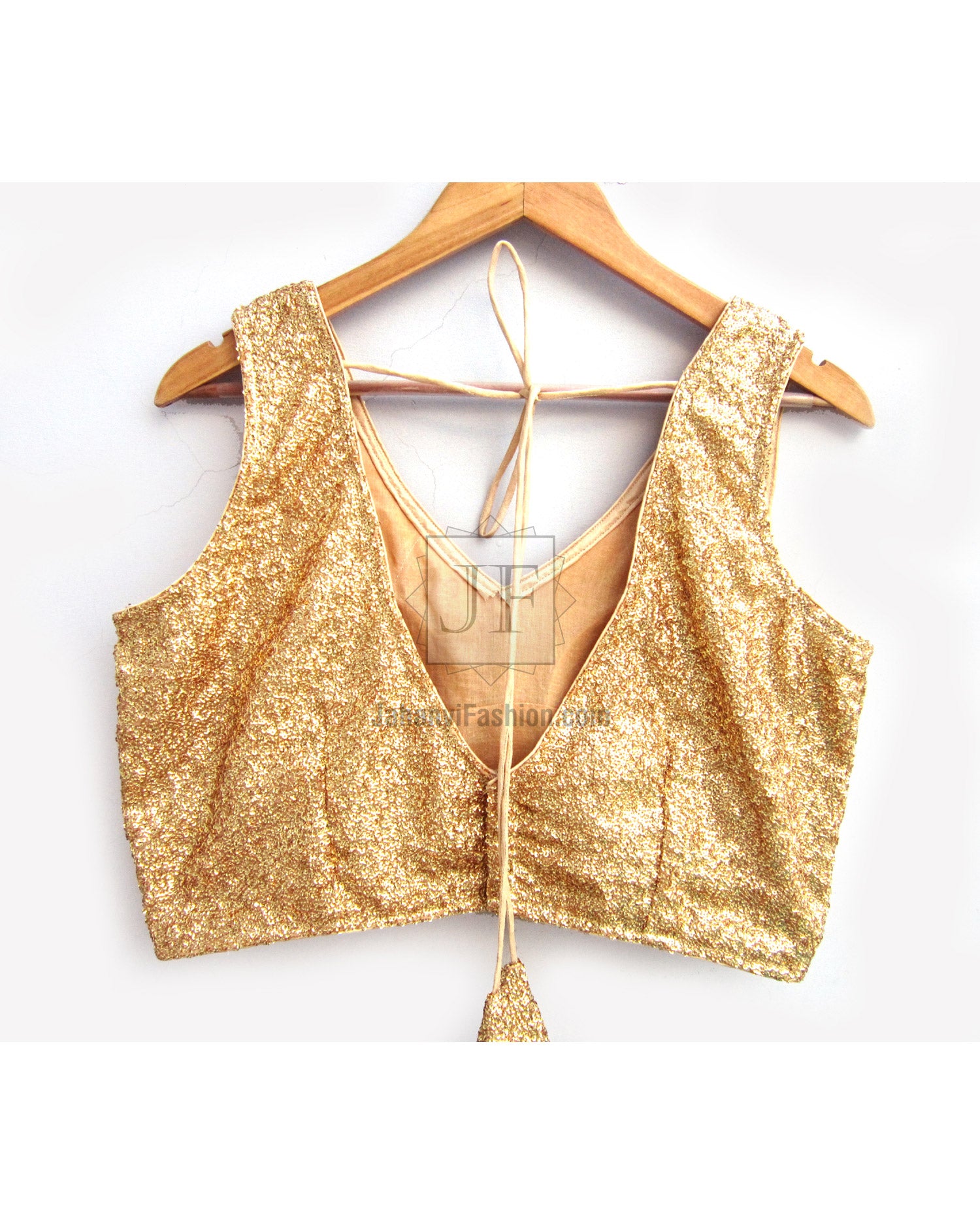 Gold sequined sleeveless blouse top with tie-back and tassel detail