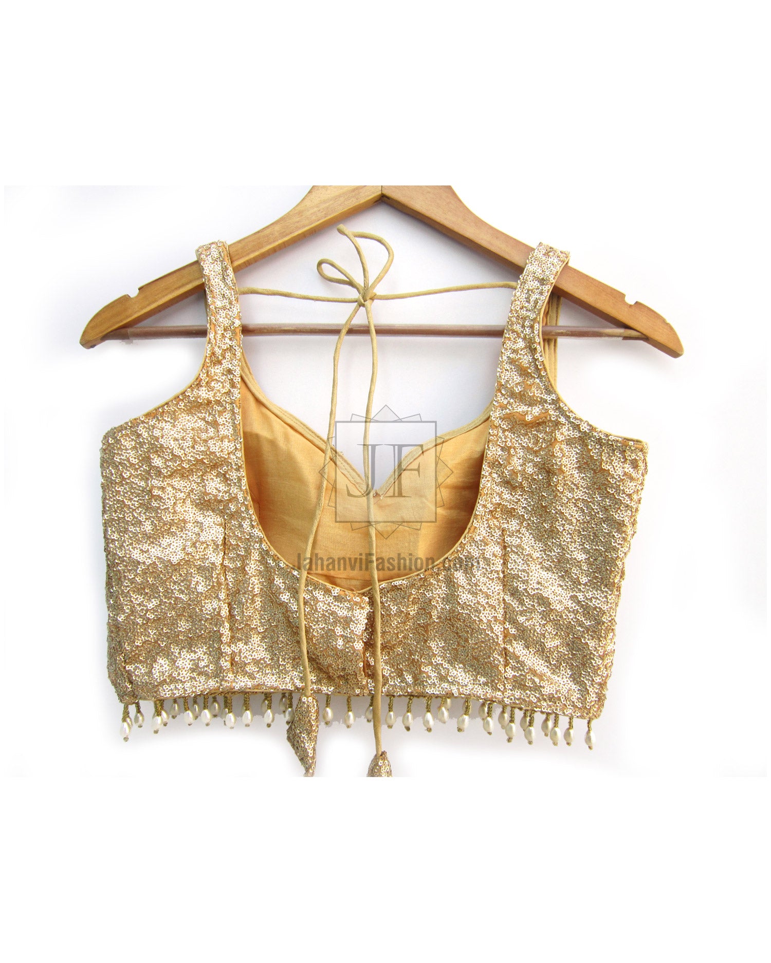 Light gold sequin sleeveless blouse with fringe trim and tie-back straps