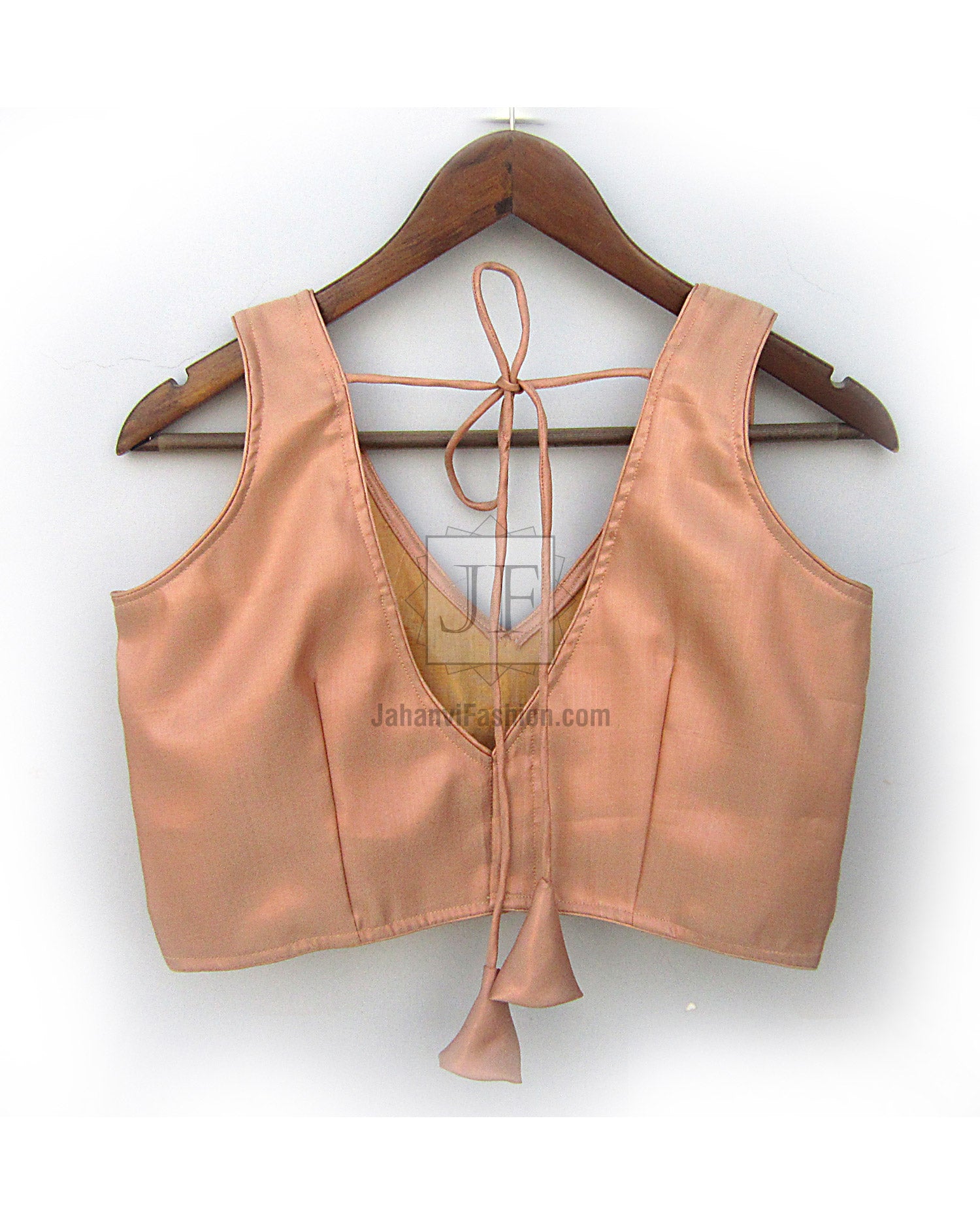 Women’s saree blouse with V-neck front, open back tied strings, light peach satin