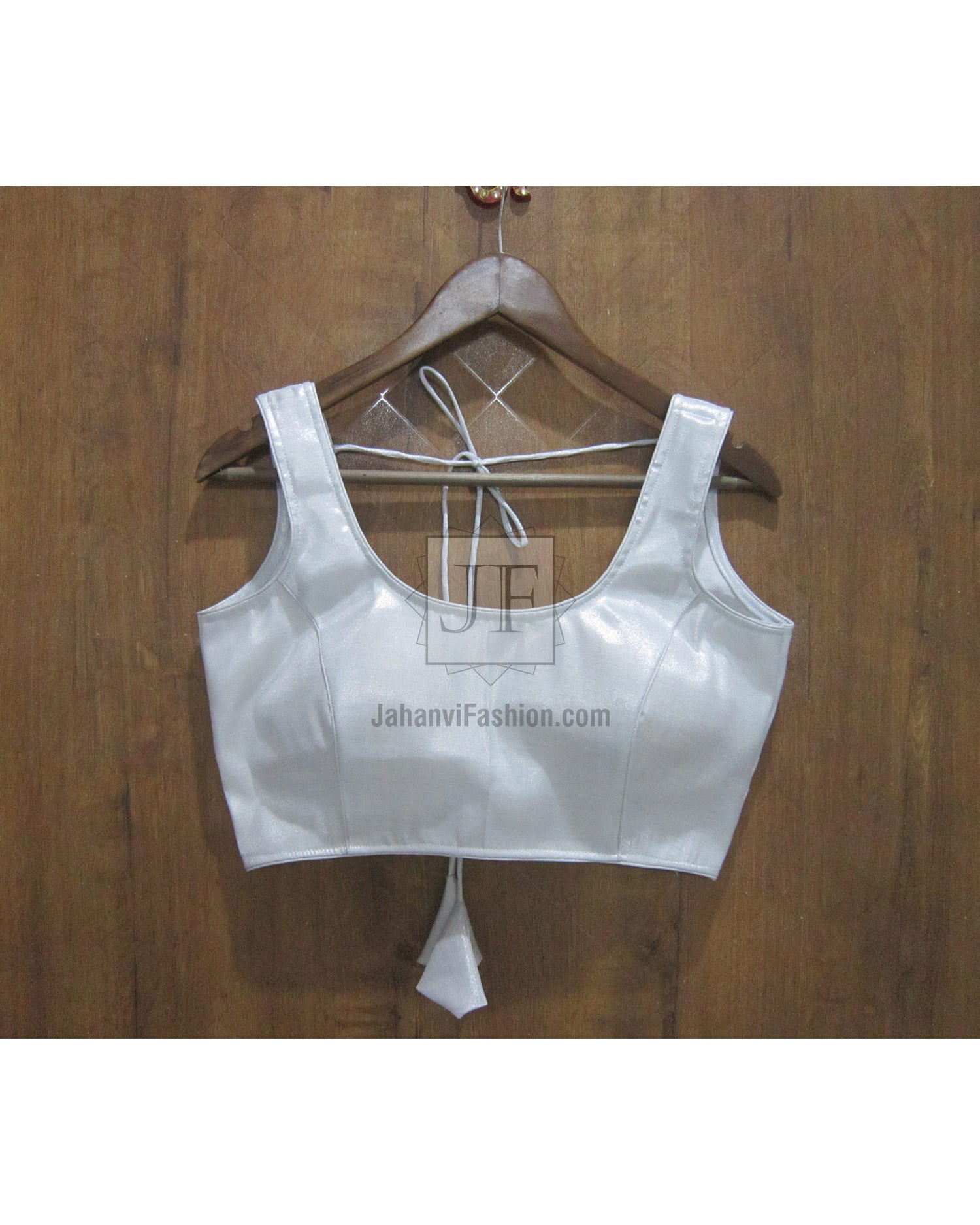 Shiny sleeveless saree blouse with open-back tie straps and back hook, cropped