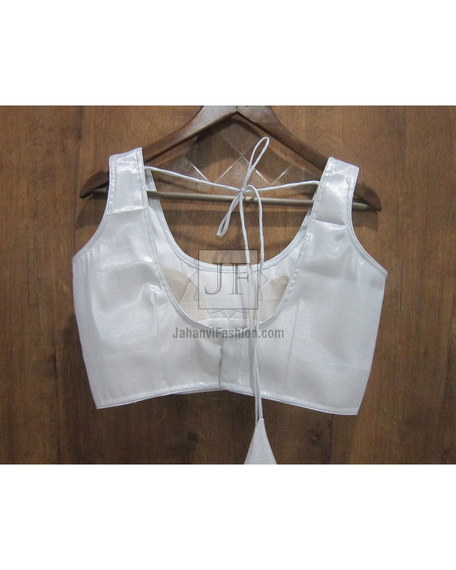 Shiny sleeveless saree blouse with open back tie strings and hook closure